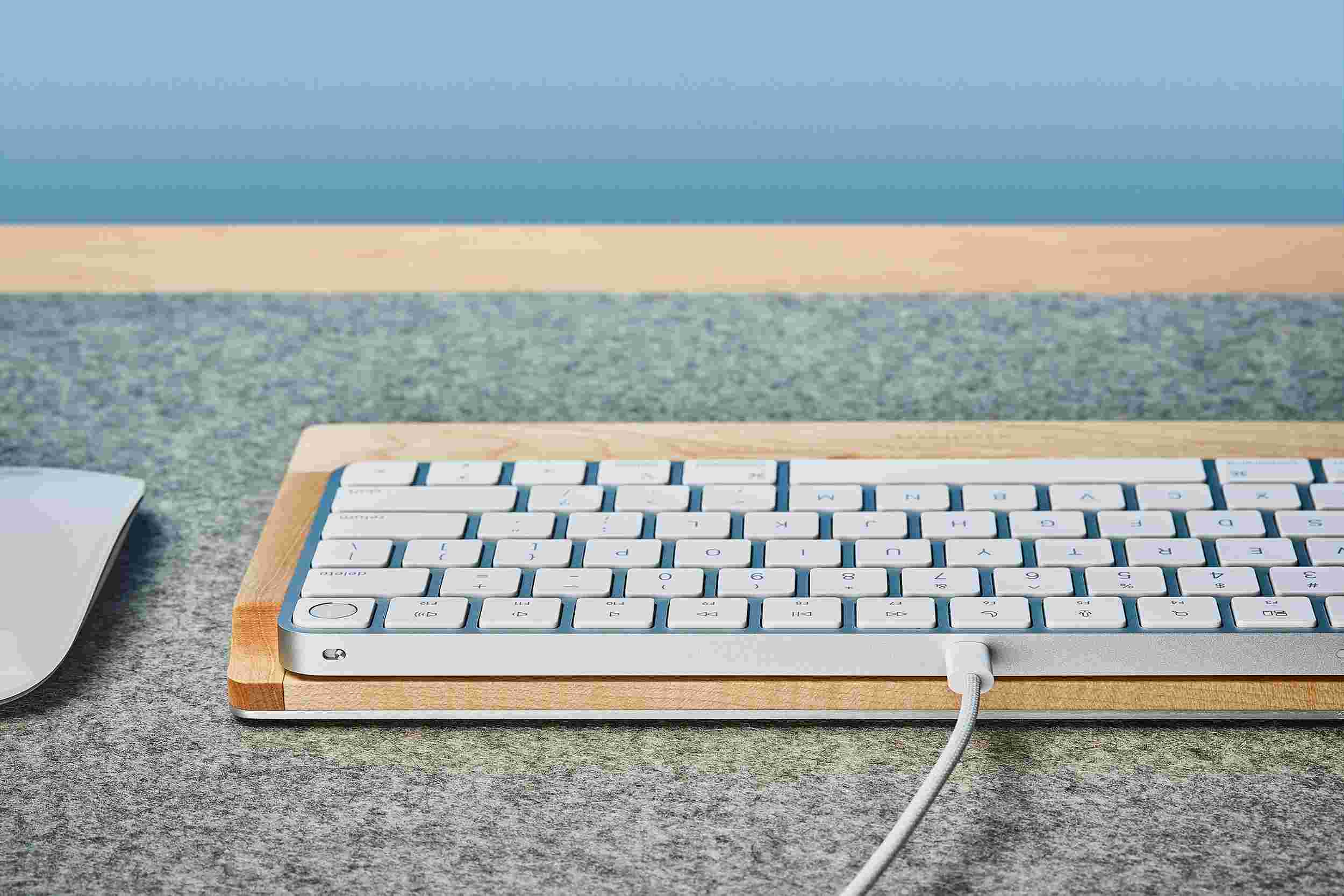 Rear view detail of the steel and maple wood keyboard tray.