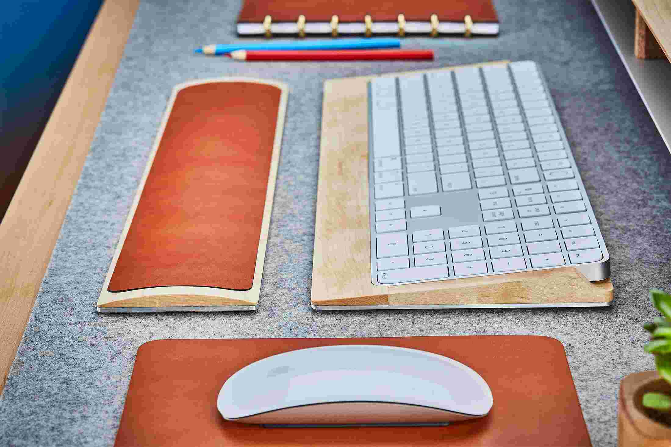 Side view detail of the steel and maple wood keyboard tray.