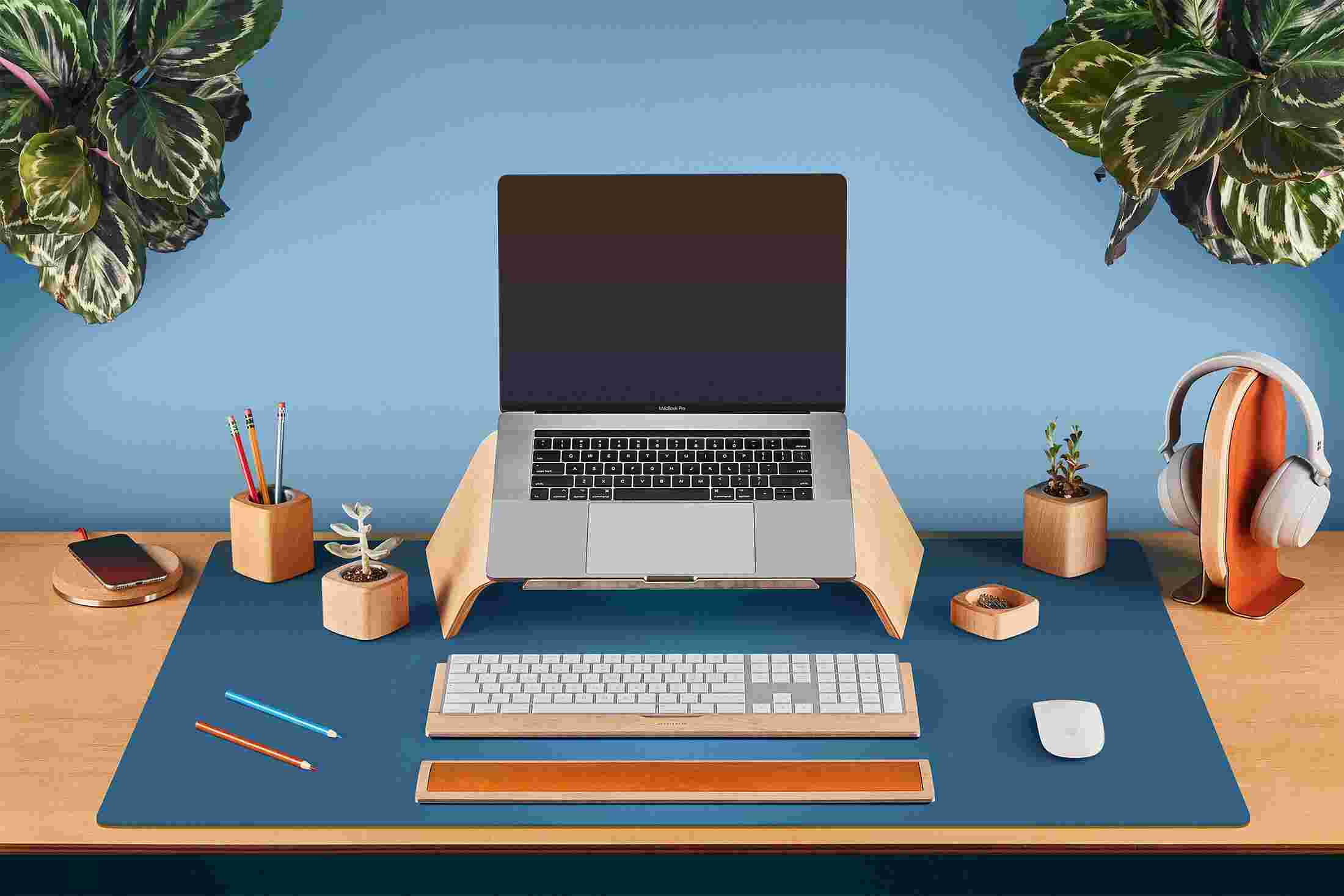 The Large Desk Pad in Navy Blue supporting the Maple Monitor Stand for iMac.