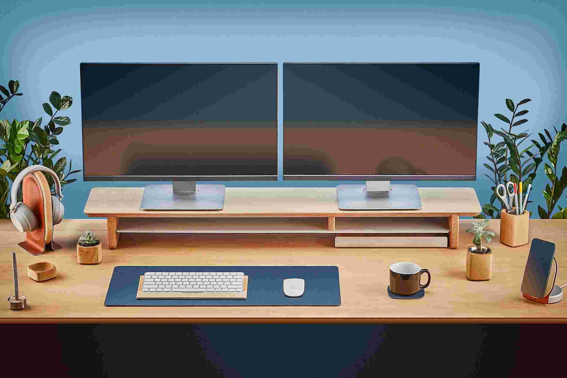The small matte navy desk pad slides easily under the desk shelf.