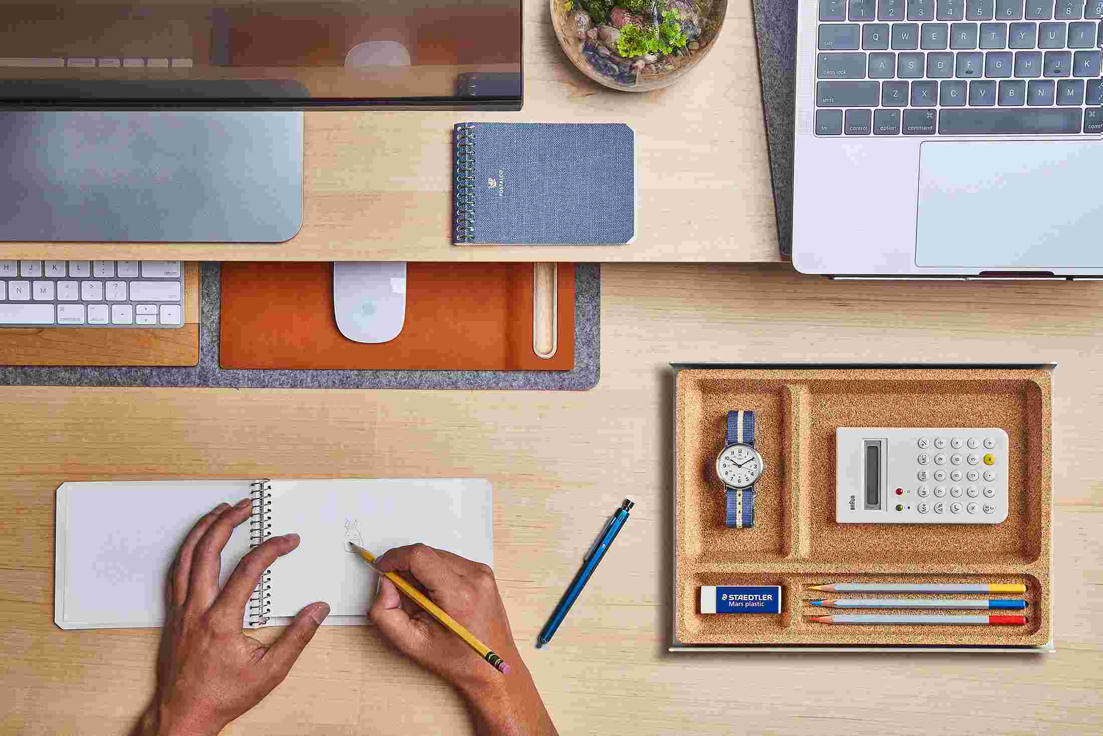 The small desk pad with keyboard and mouse slid under the maple desk shelf to free up working space.