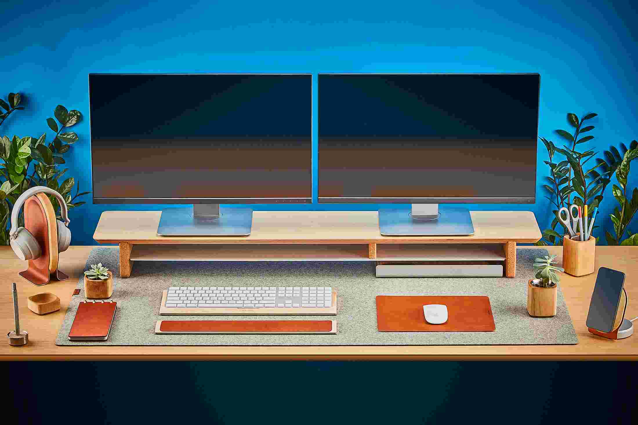 The Extra Large Felt Desk Pad covering almost an entire desktop, in use with the Maple Desk Shelf System.