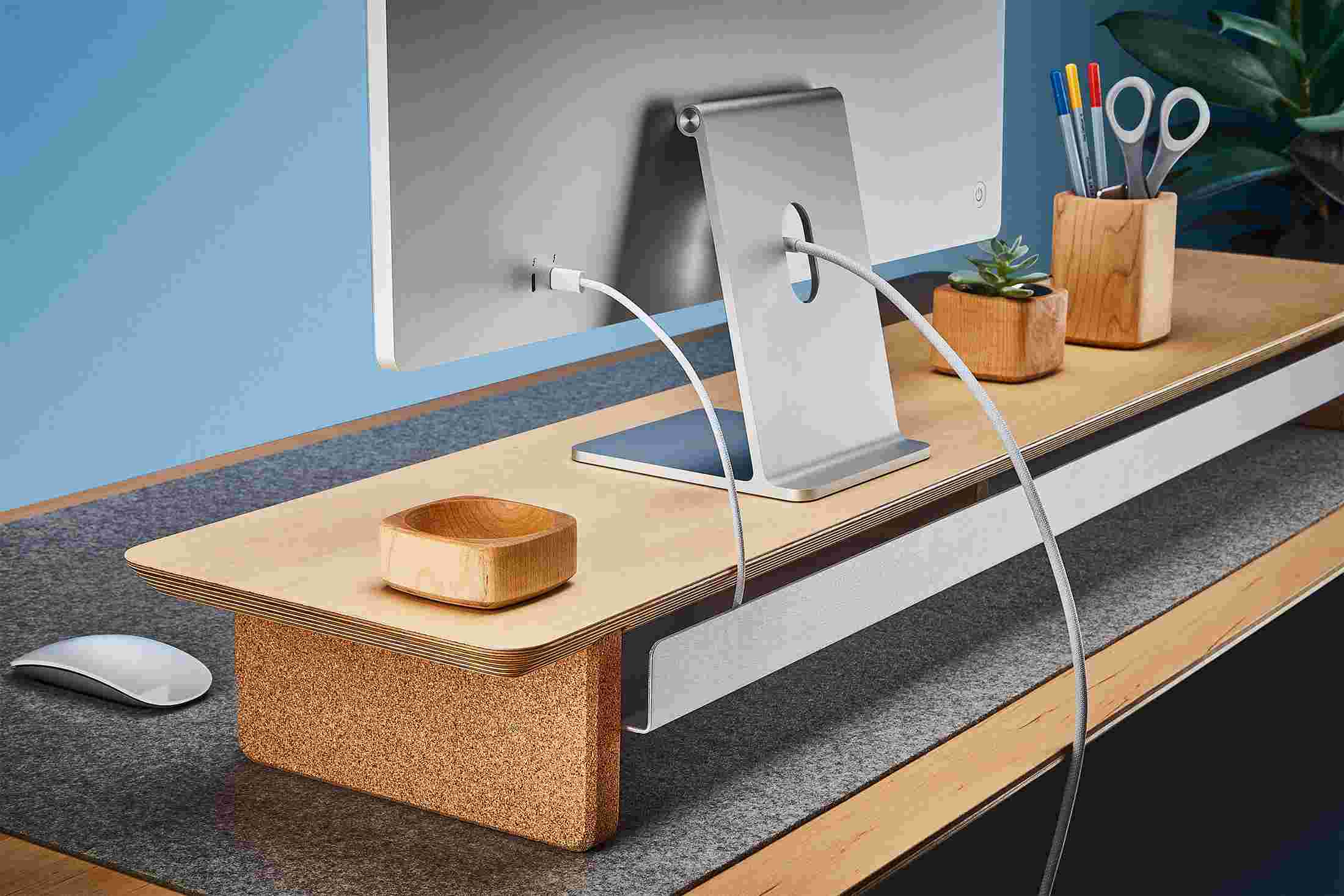 Rear view of the maple shelf showing the back edge of the bent metal shelf, designed to keep your stuff in place, while leaving space for hidden cord access.