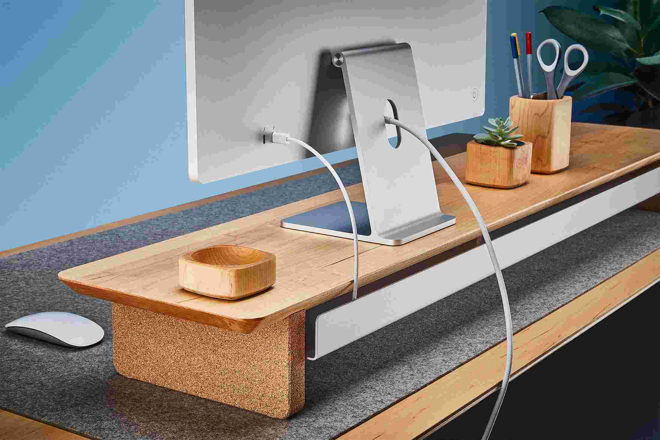 Rear view of the maple shelf showing the back edge of the bent metal shelf, designed to keep your stuff in place, while leaving space for hidden cord access.