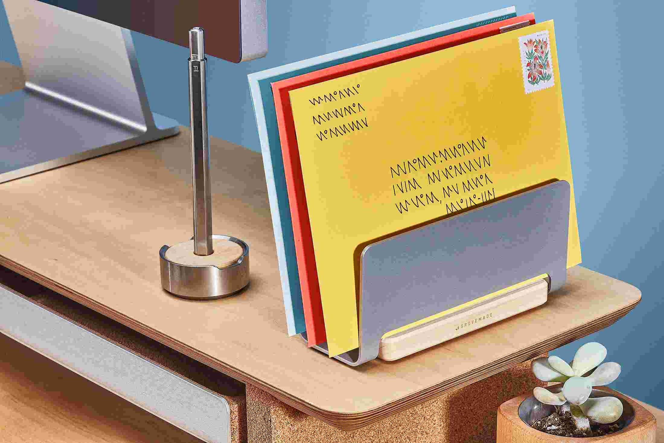 The Maple Vertical Organizer with mail and letters filed into three separate divisions.