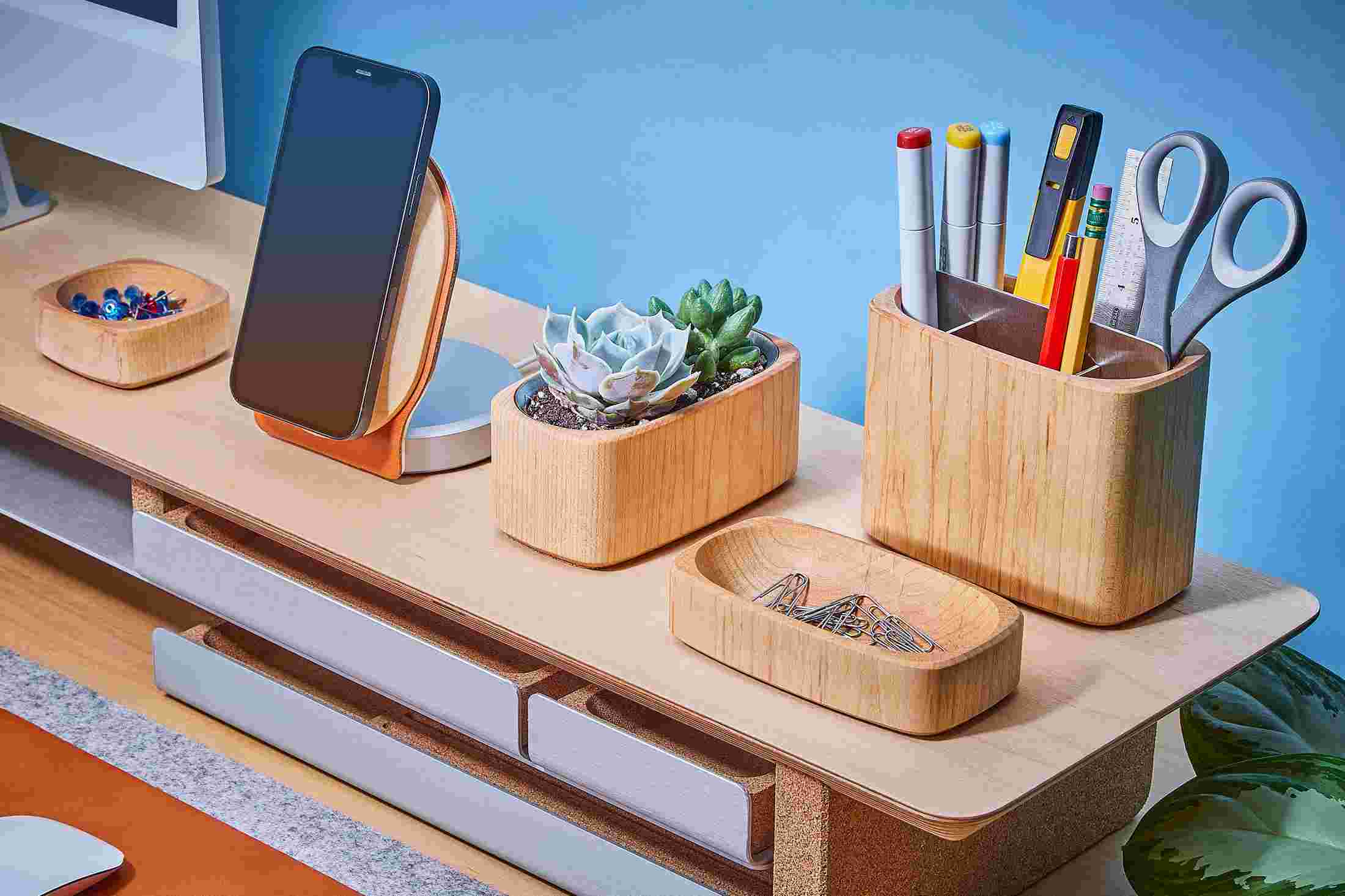 Full assortment of maple organizer trays, compartments, and dishes, with matching Walnut iPhone Dock.