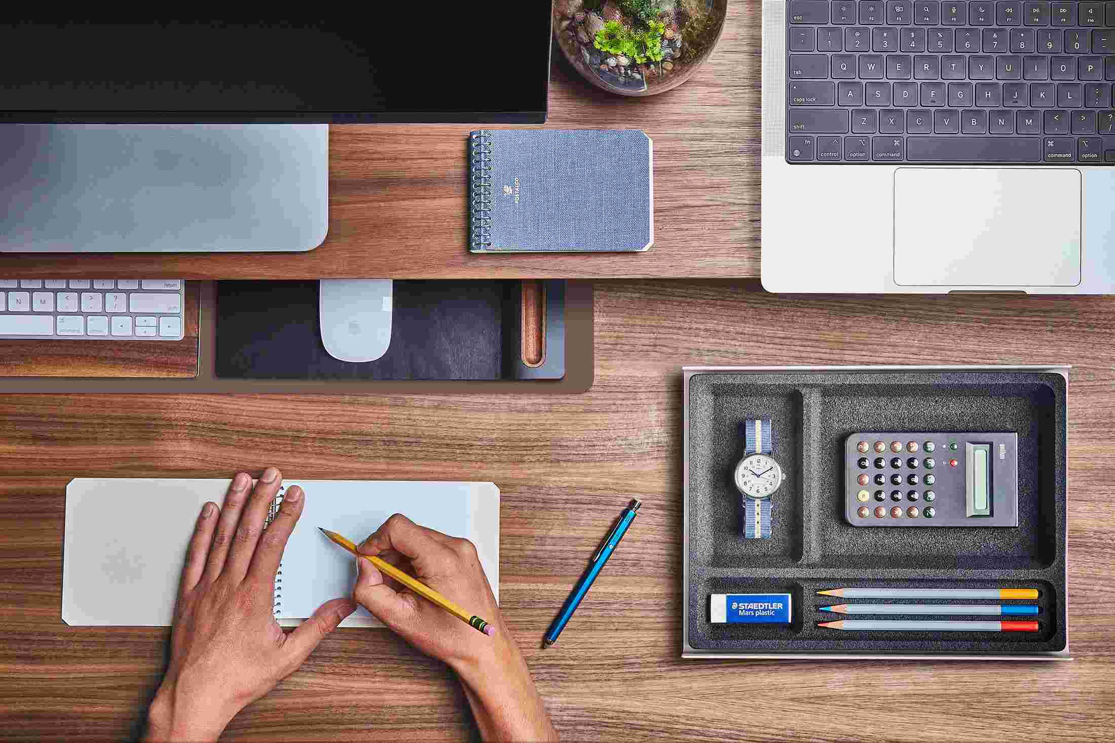 The Small Brown Desk Pad tucked under the Walnut Desk Shelf, creating space to sketch and write.