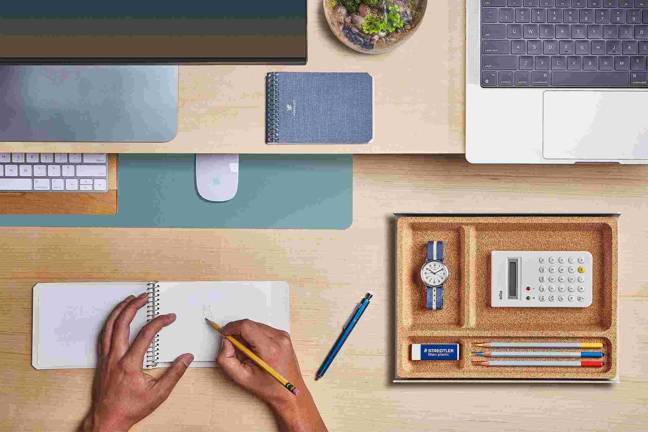 The Small Light Blue Desk Pad tucked under the Walnut Desk Shelf, creating space to sketch and write.