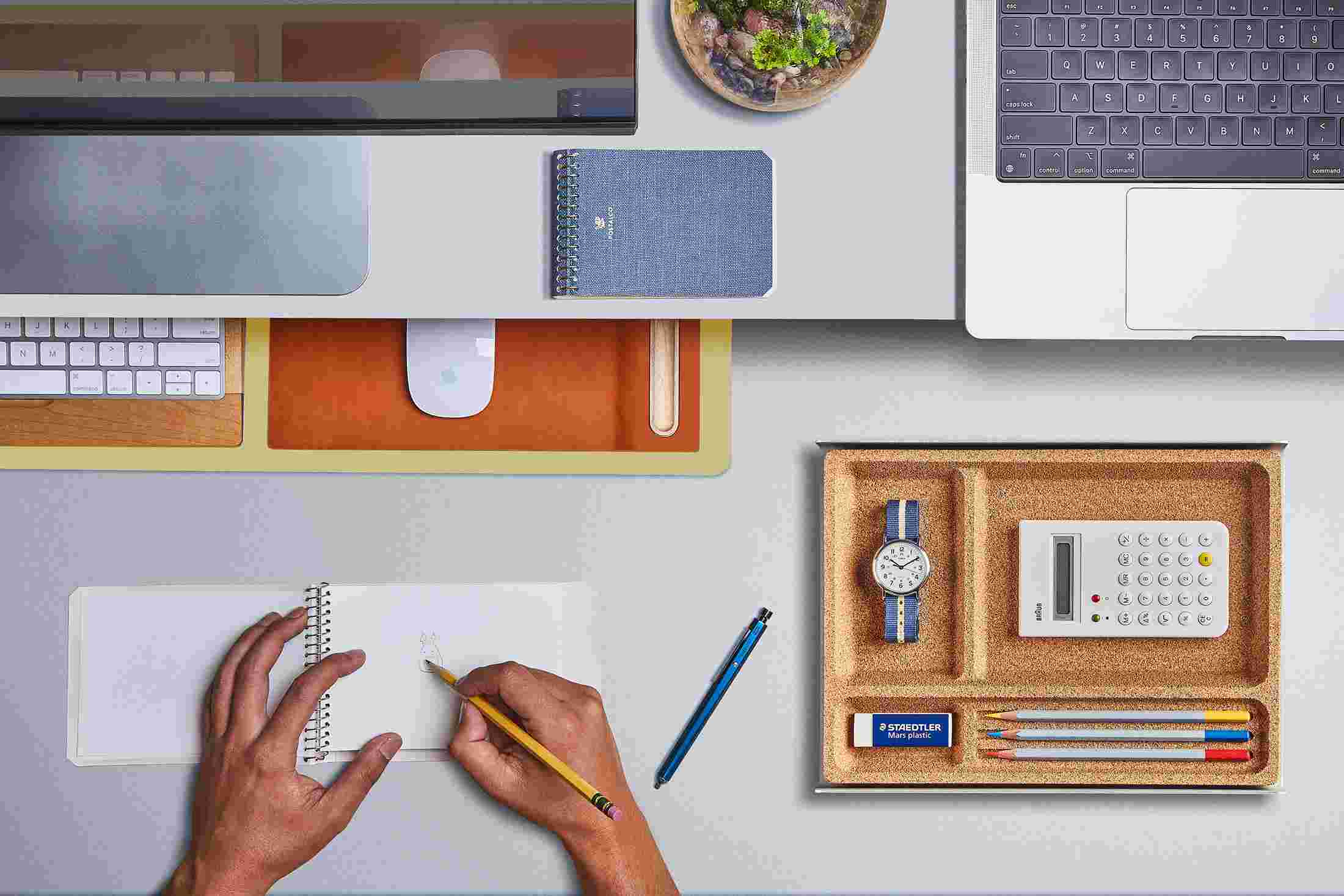 The Small Light Yellow Desk Pad tucked under the Matte White Desk Shelf, creating space to sketch and write.