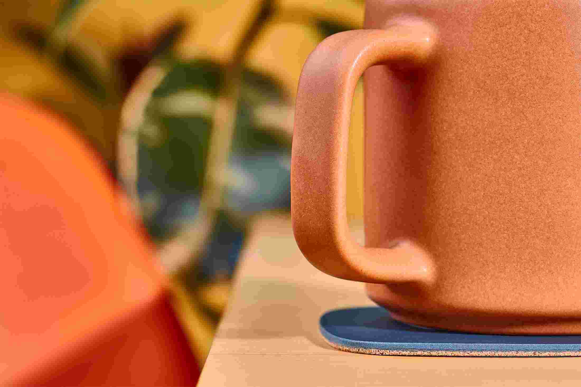 Side view of the Matte Navy Blue Coaster showing the natural cork layer.