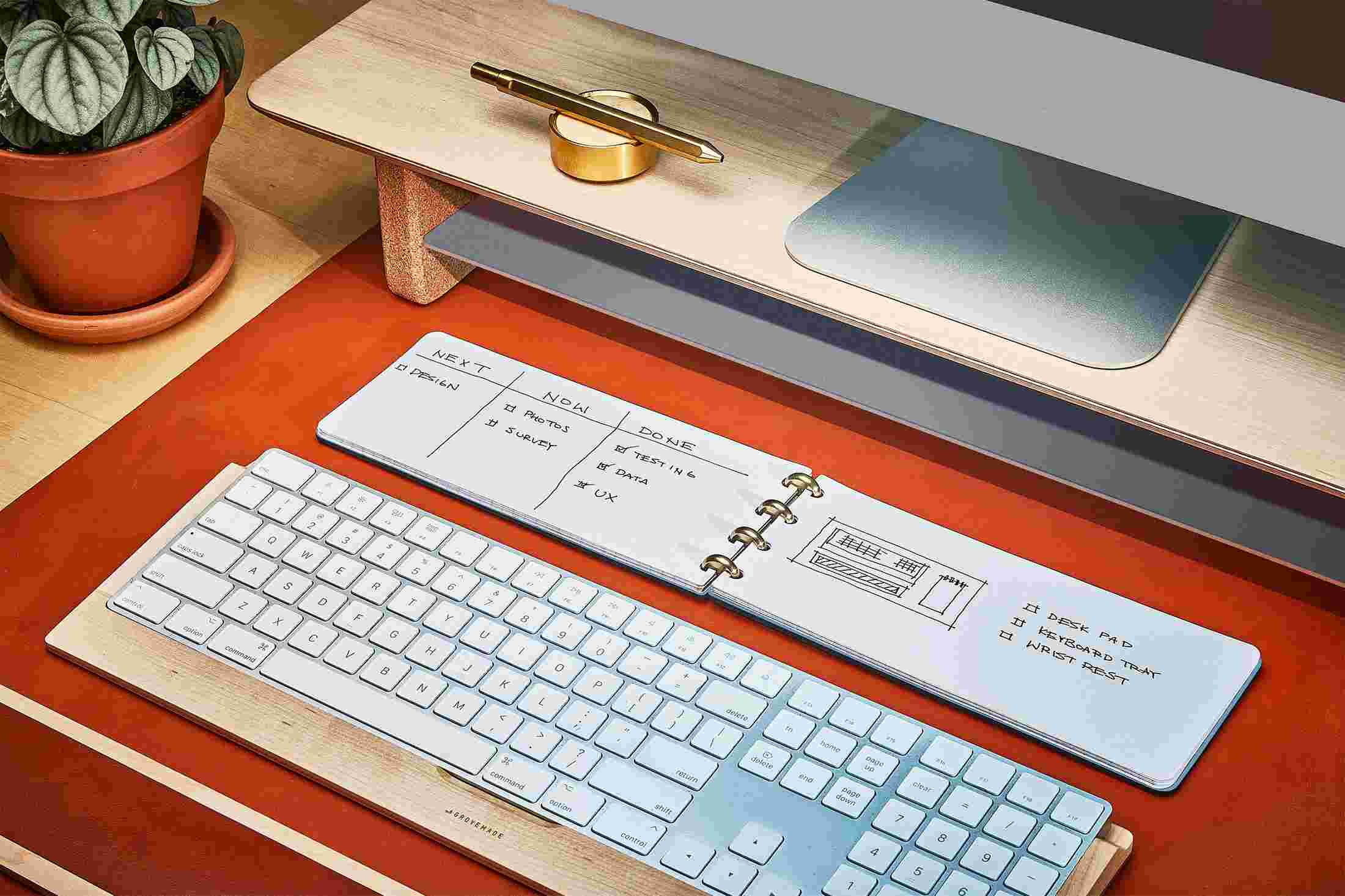 Extra wide ring bound tan notebook, fitted to live on your desktop.