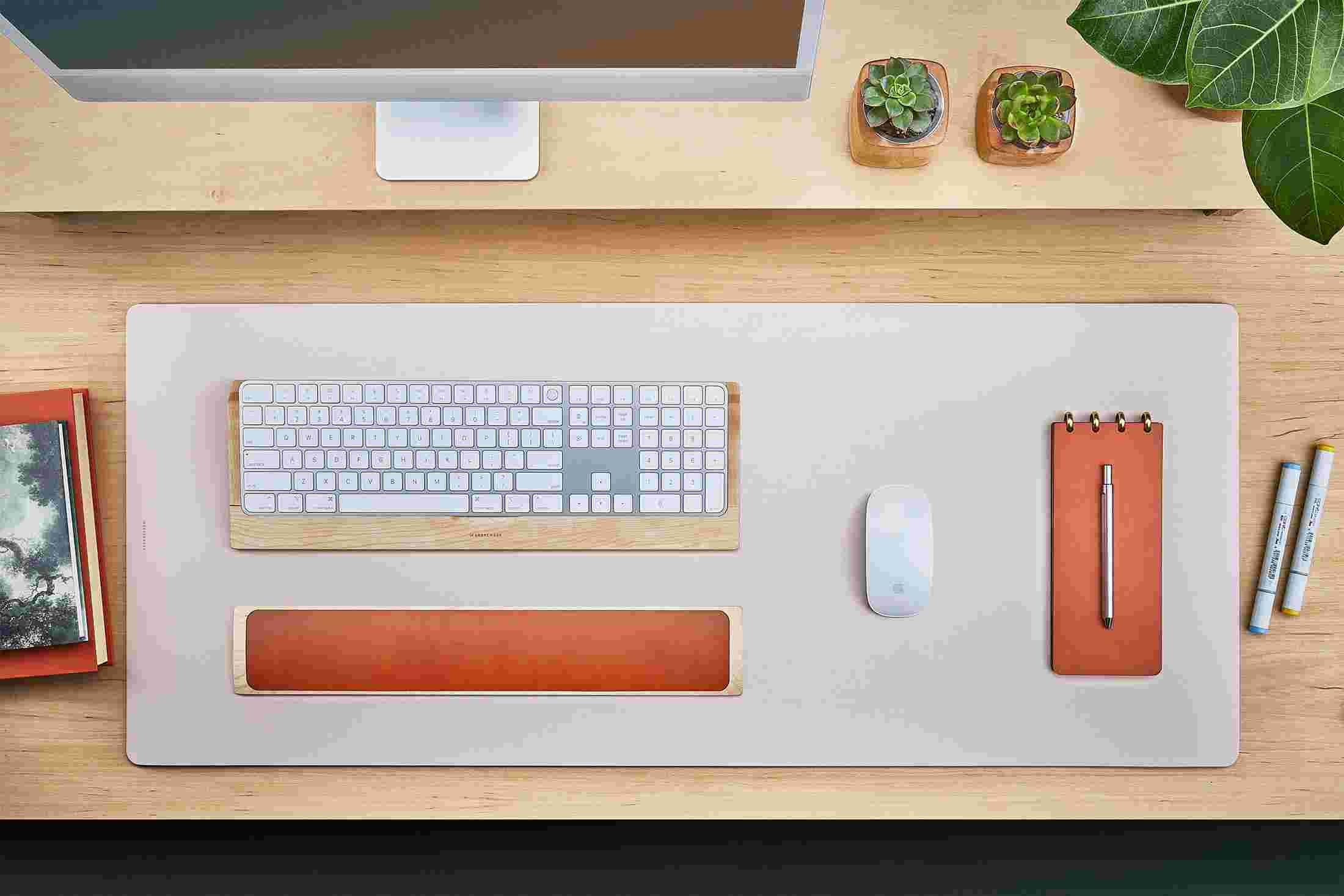 Overhead view of the Light Pink Matte Desk Pad.