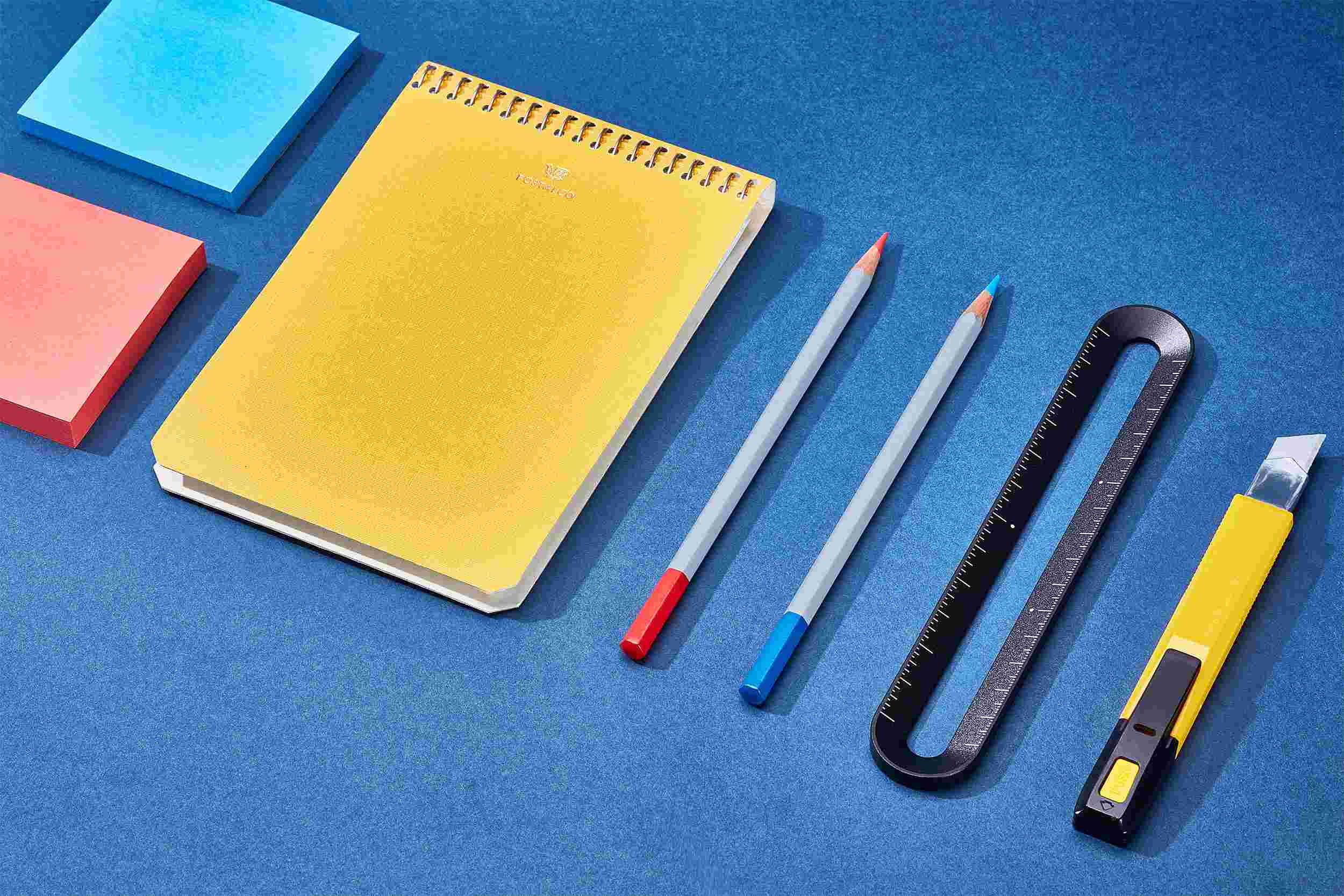 The Grovemade 6-Inch Ruler on blue paper with crafting tools.