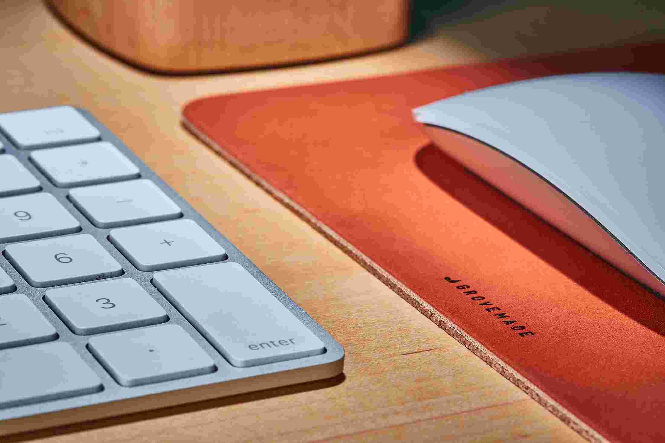 Detail of layered tan leather and natural cork of the Grovemade Leather Mouse Pad.