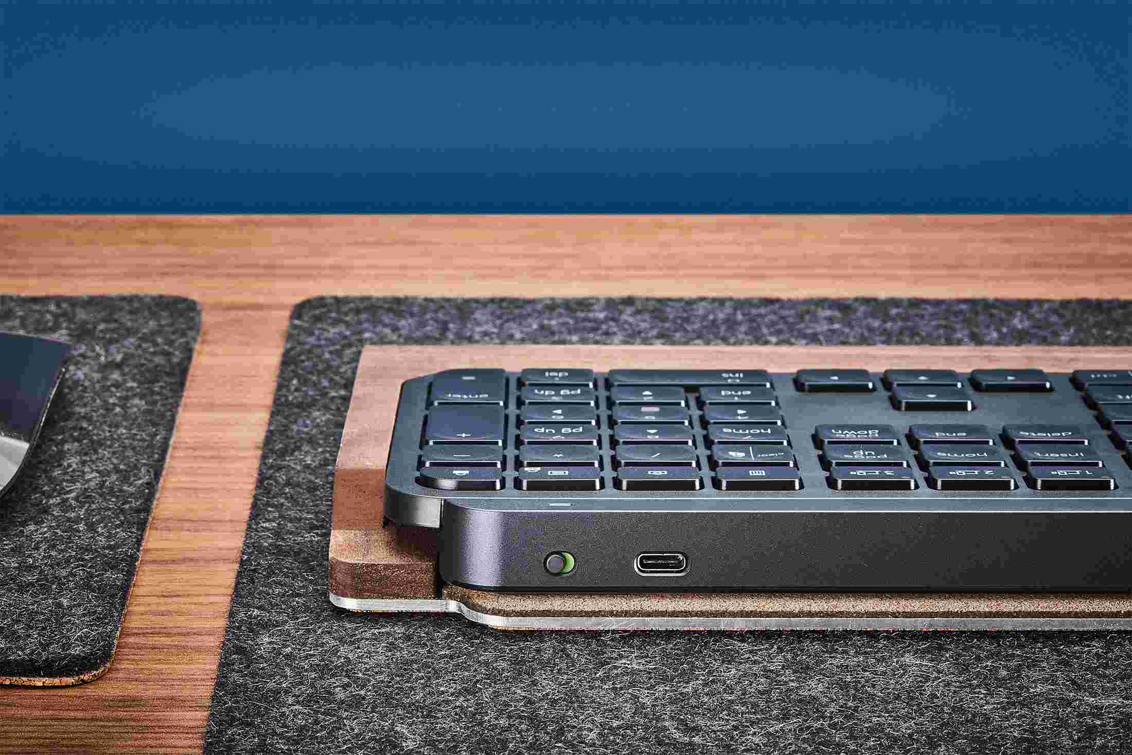 The back of the Walnut MX Keys Keyboard Tray, open for access to the charging port.