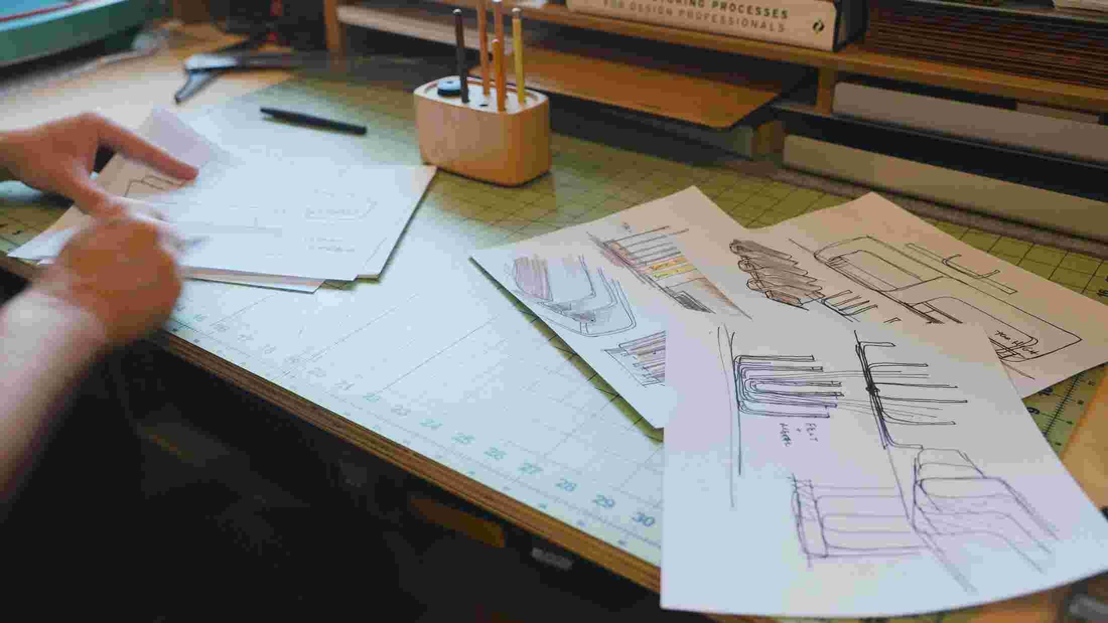 Early rough sketches for the Vertical Organizer spread across the Grovemade design area.