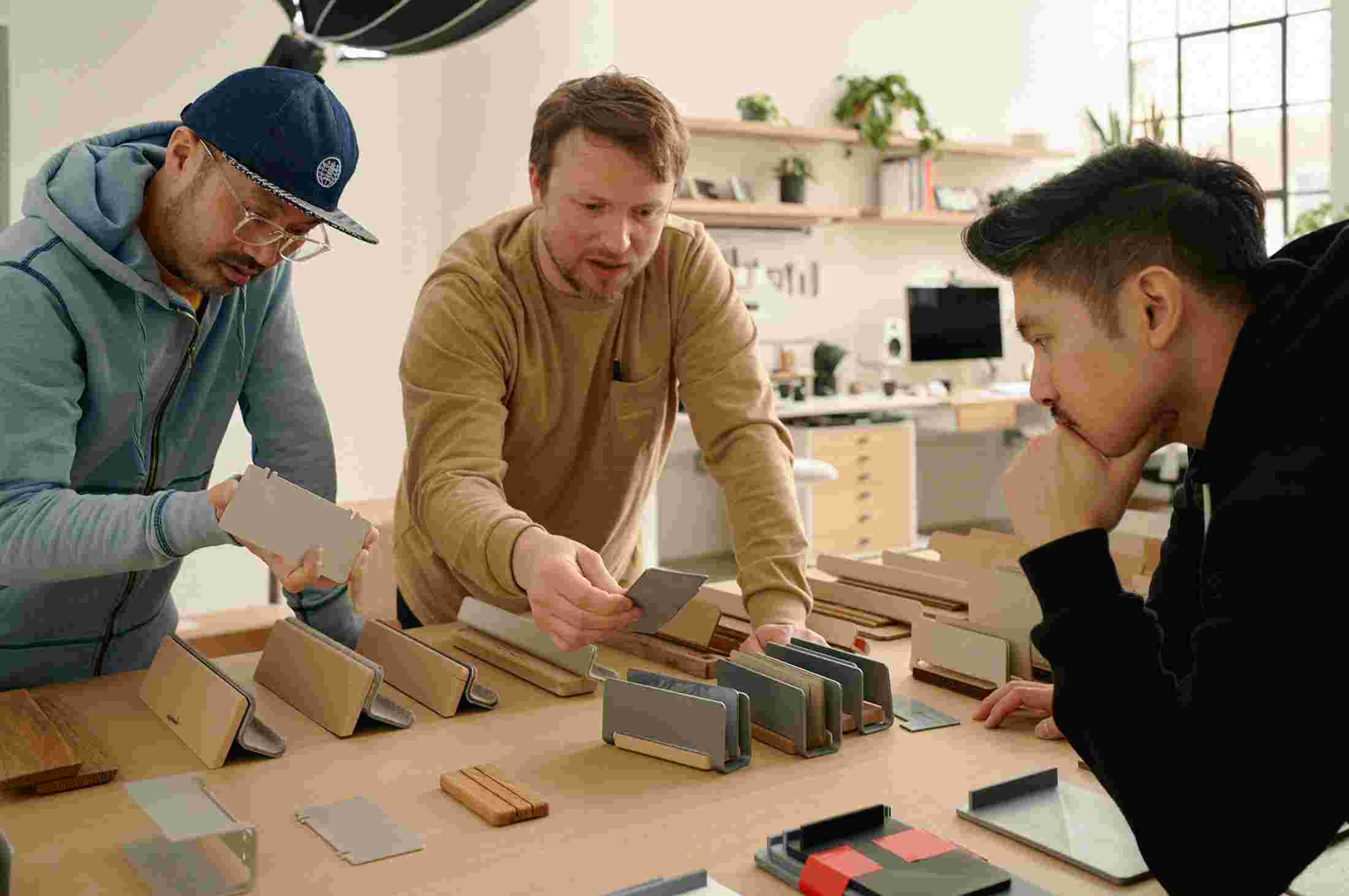 Ken, Sean, and Matthew reviewing multiple generations of prototypes for the note-taking kit.