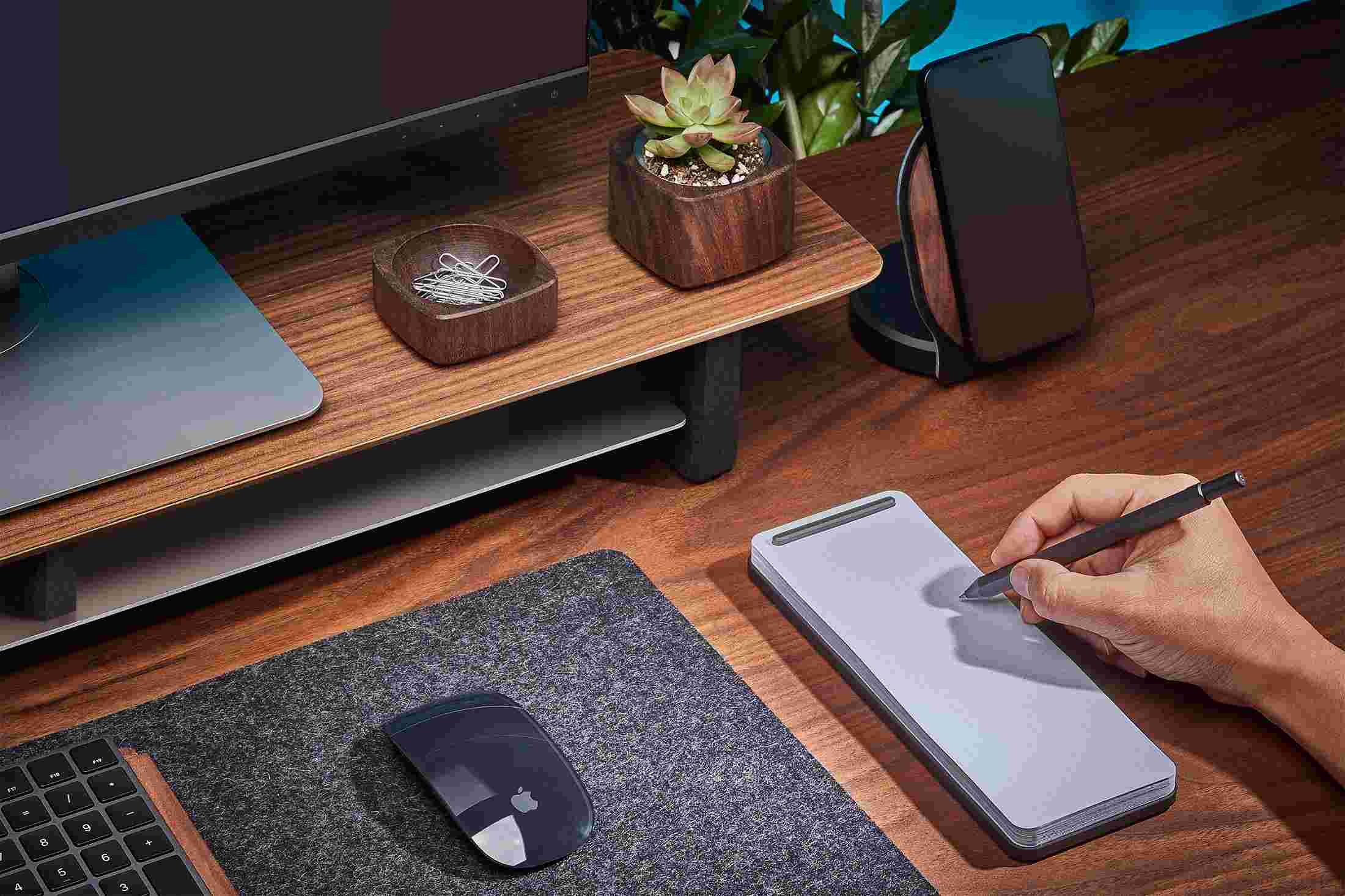 Modern desk notepad in black, with walnut desk shelf.