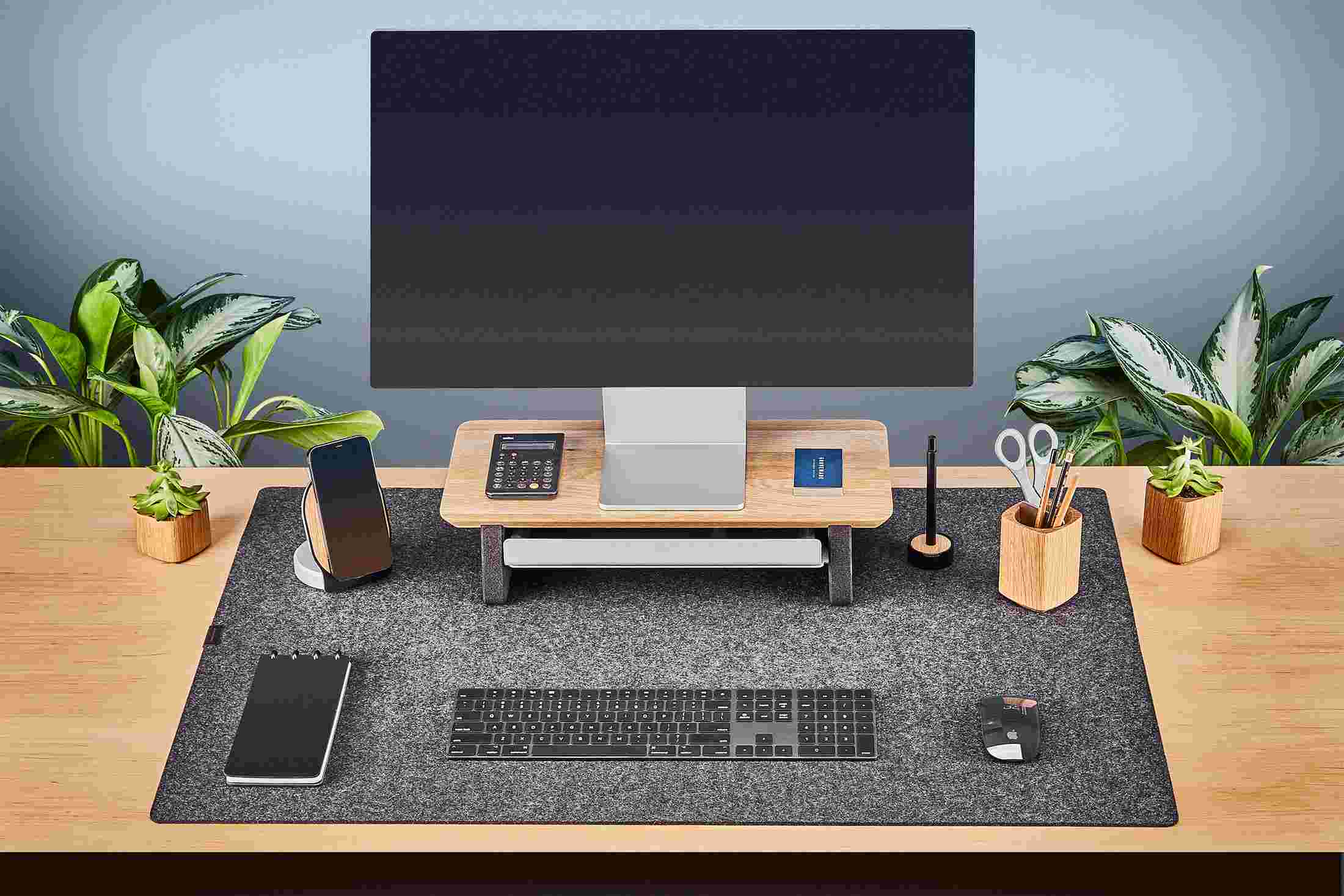 Small White Oak Desk Shelf shown with Apple Cinema Display and wool felt desk pad.