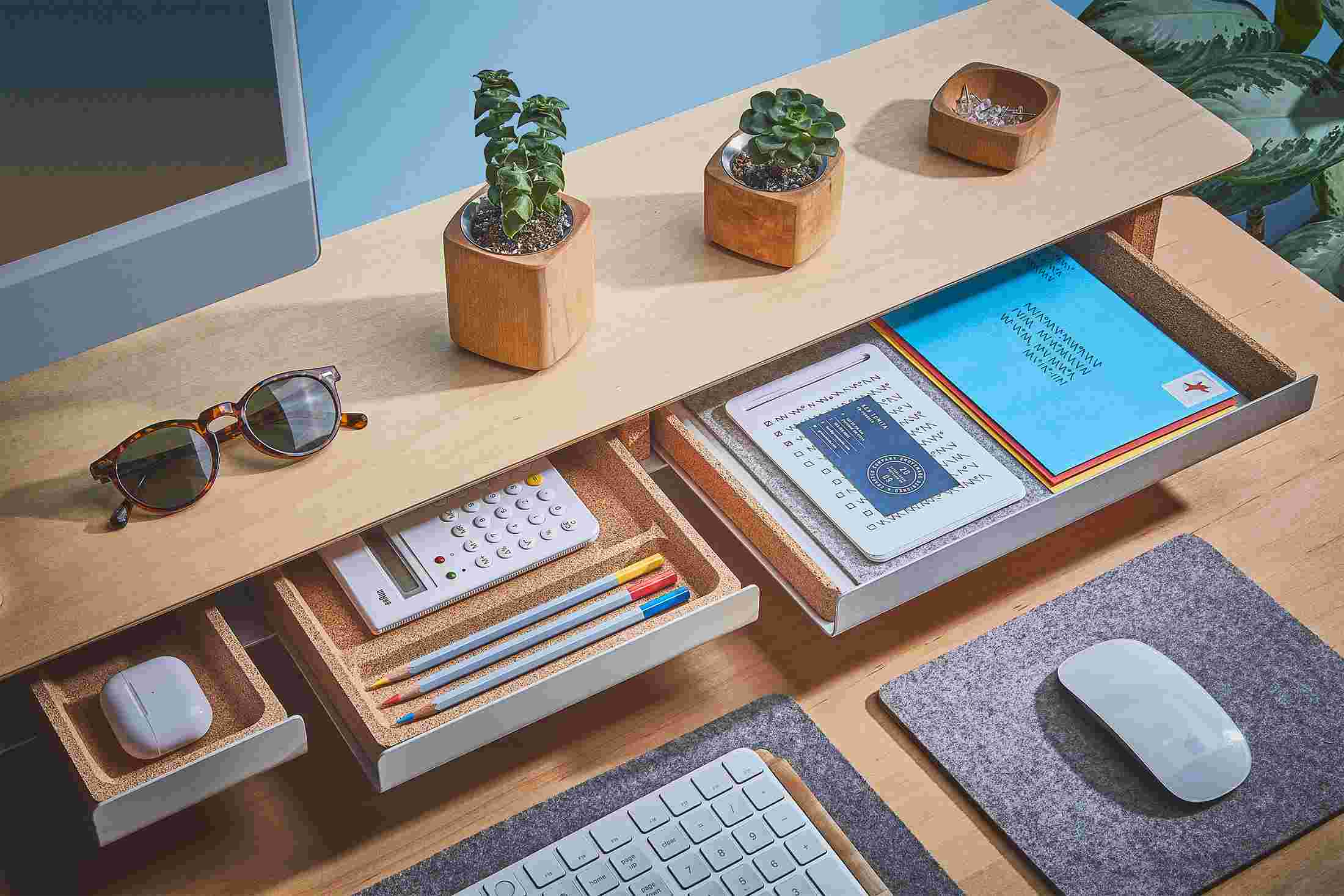 The Light Paper Tray pulled out from the Maple Desk Shelf with matching small and medium natural cork trays.