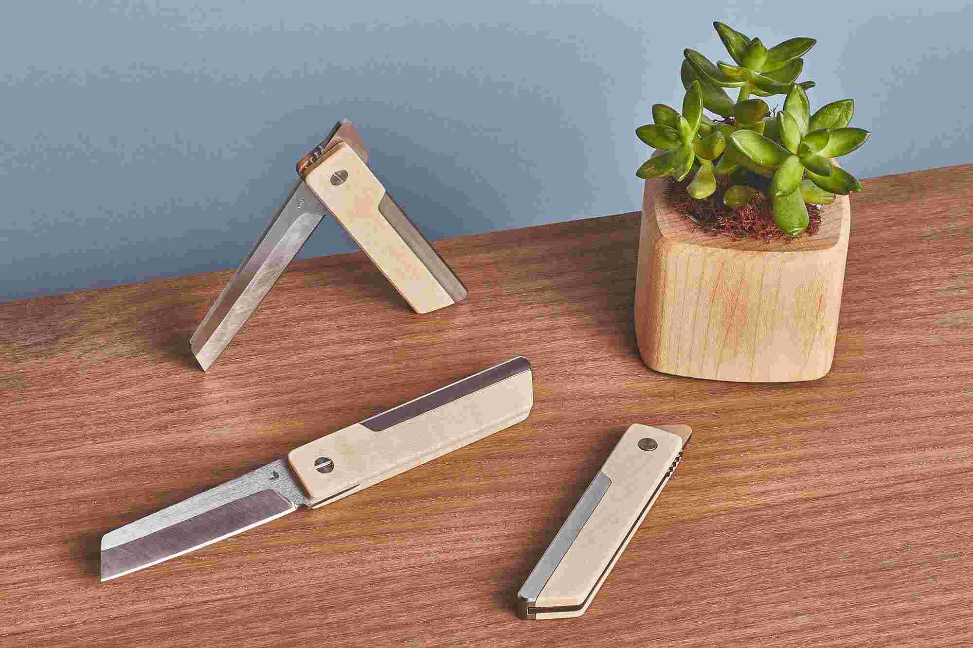 Three higonokami-inspired pocket knives—one open, one halfway open, and one closed.