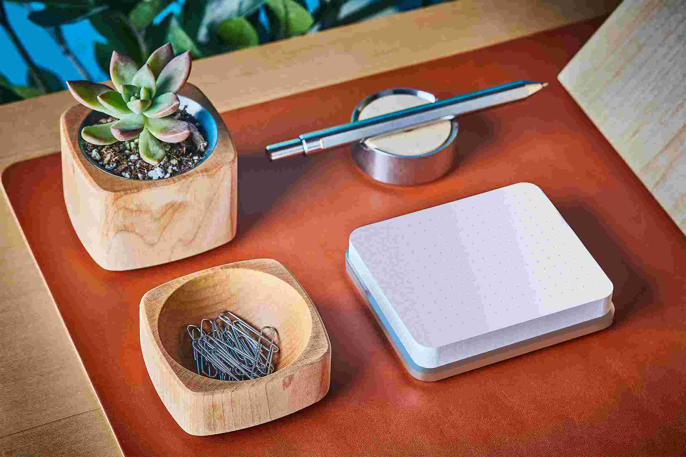 Modern sticky note station in solid steel with matching pen and stand.