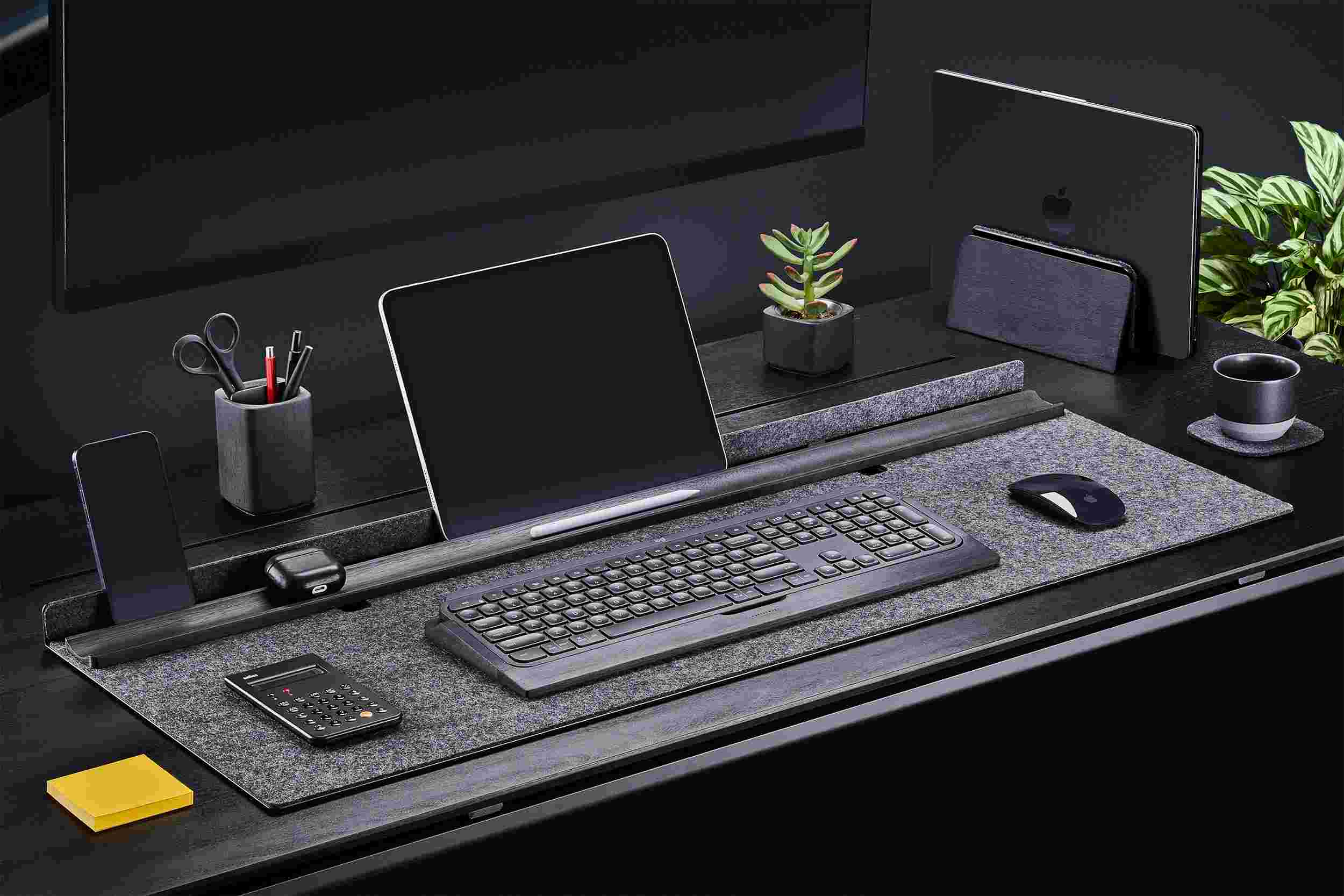 Wool and blackened walnut desk station with matching wood keyboard tray and MacBook stand.