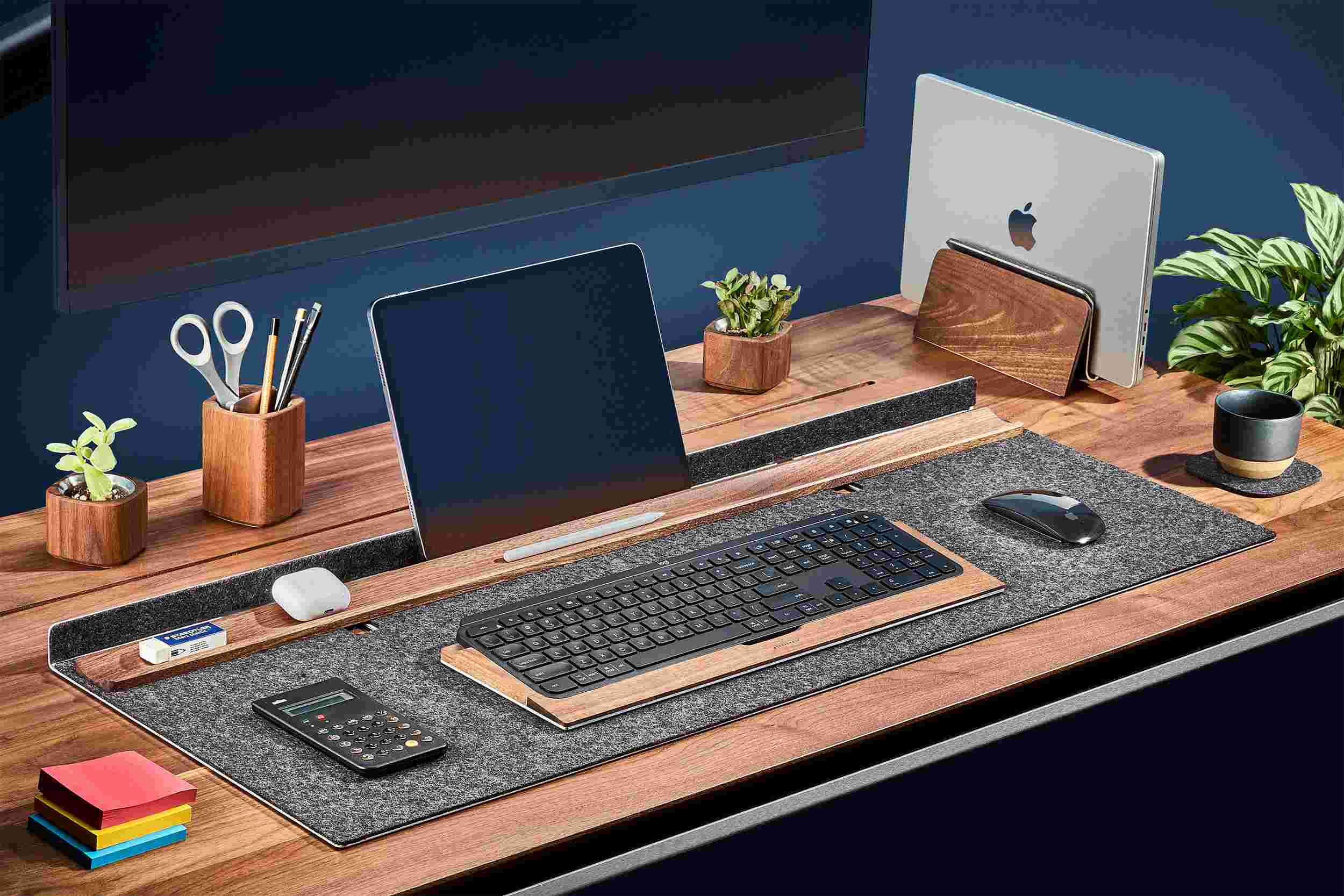 Wool and walnut desk station with matching wood keyboard tray and MacBook stand.