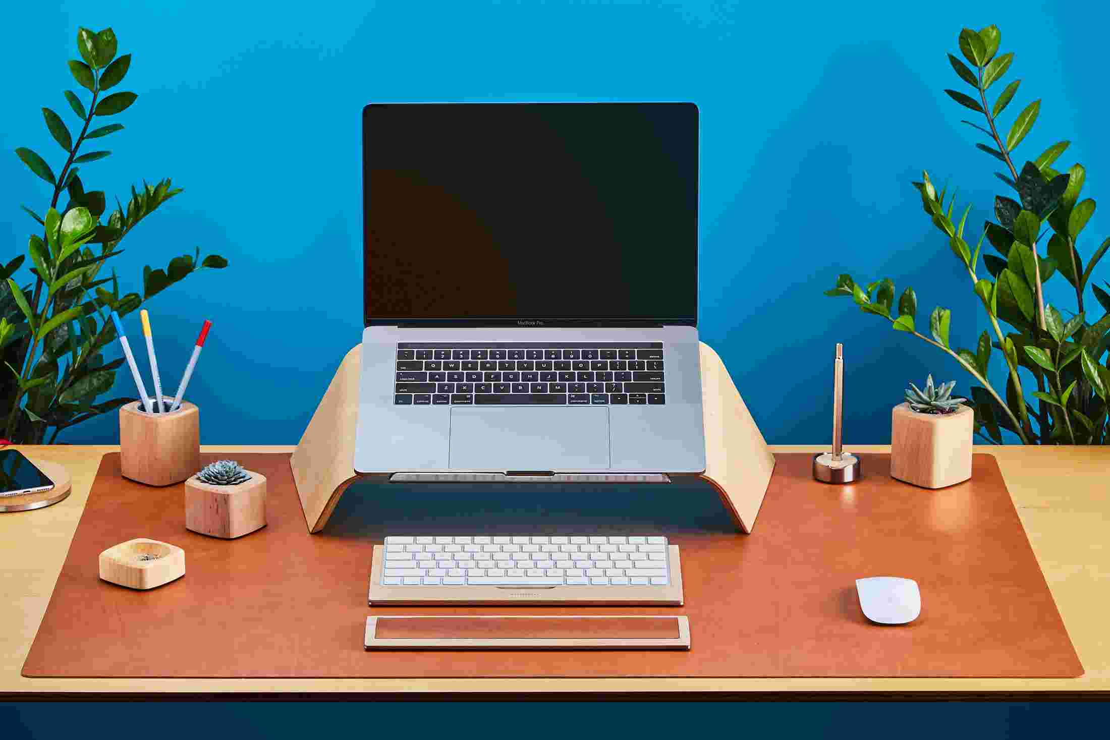 The Large Desk Pad in Tan Leather supporting the Maple Laptop Stand for MacBook.