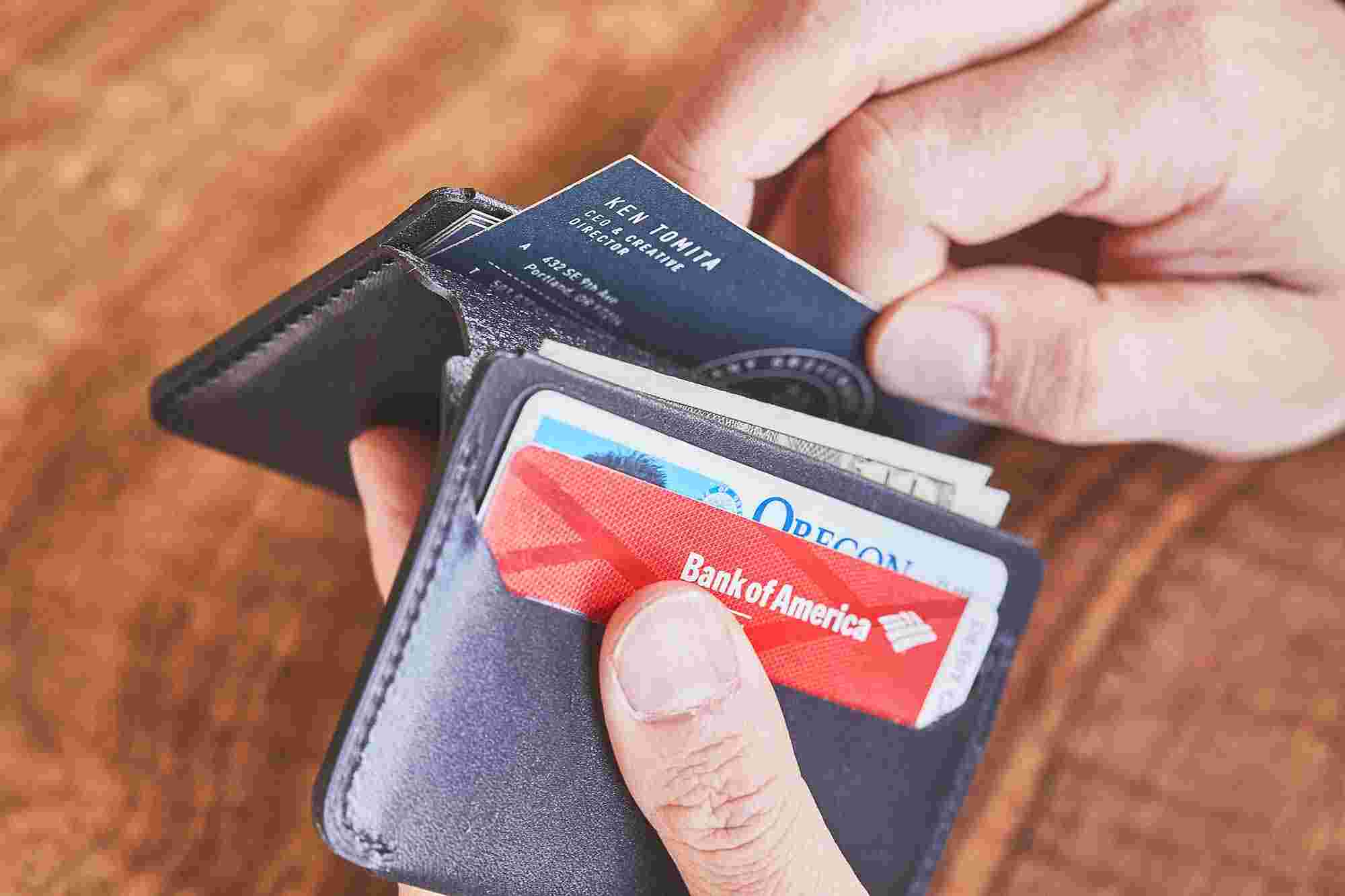 The hidden compartment inside the Grovemade Black Bifold Wallet.