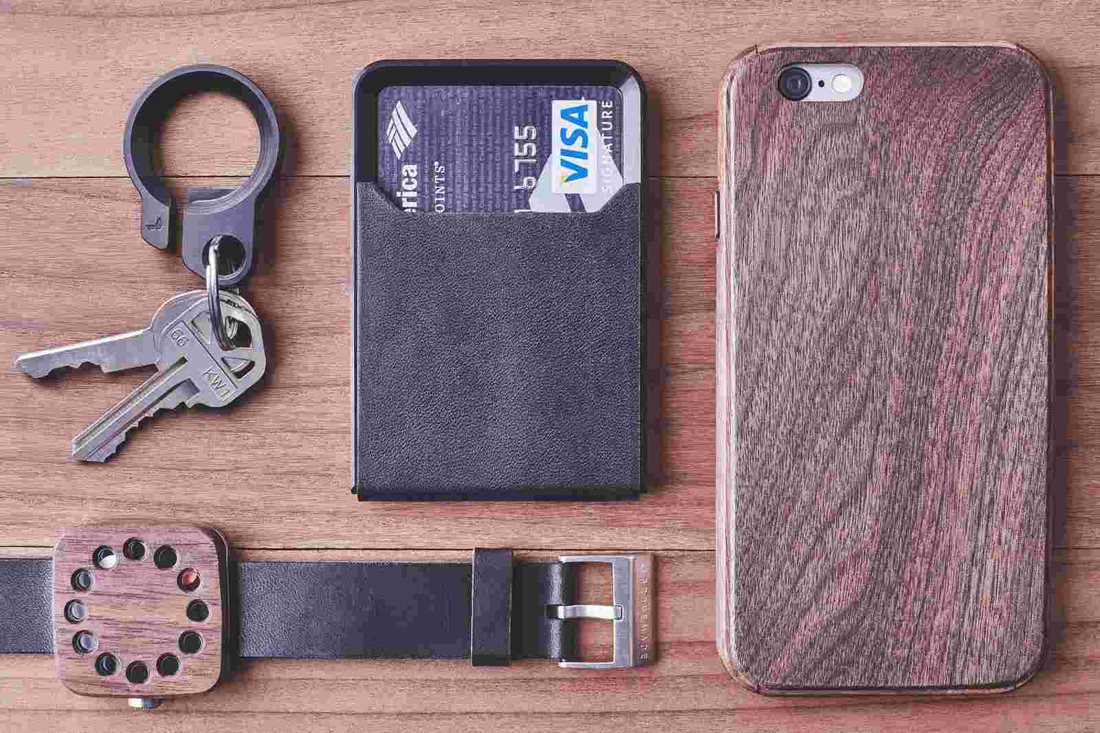 The Walnut Wood Everyday Carry Collection with iPhone Case, Wood Watch, Small Card Wallet, and bottle opening key ring.