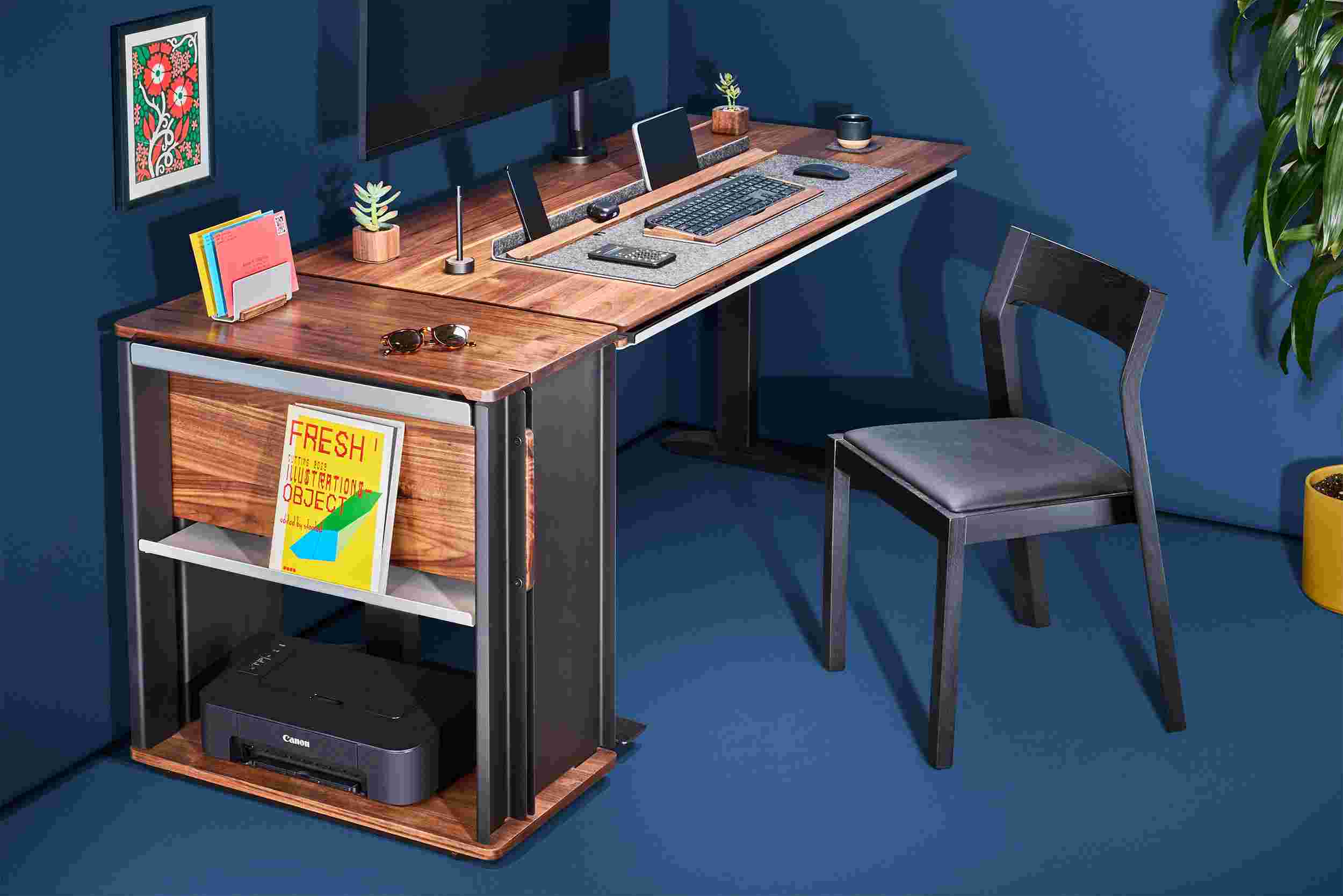 The walnut desk cart capping off the end of the matching walnut desk with space for a standard printer.