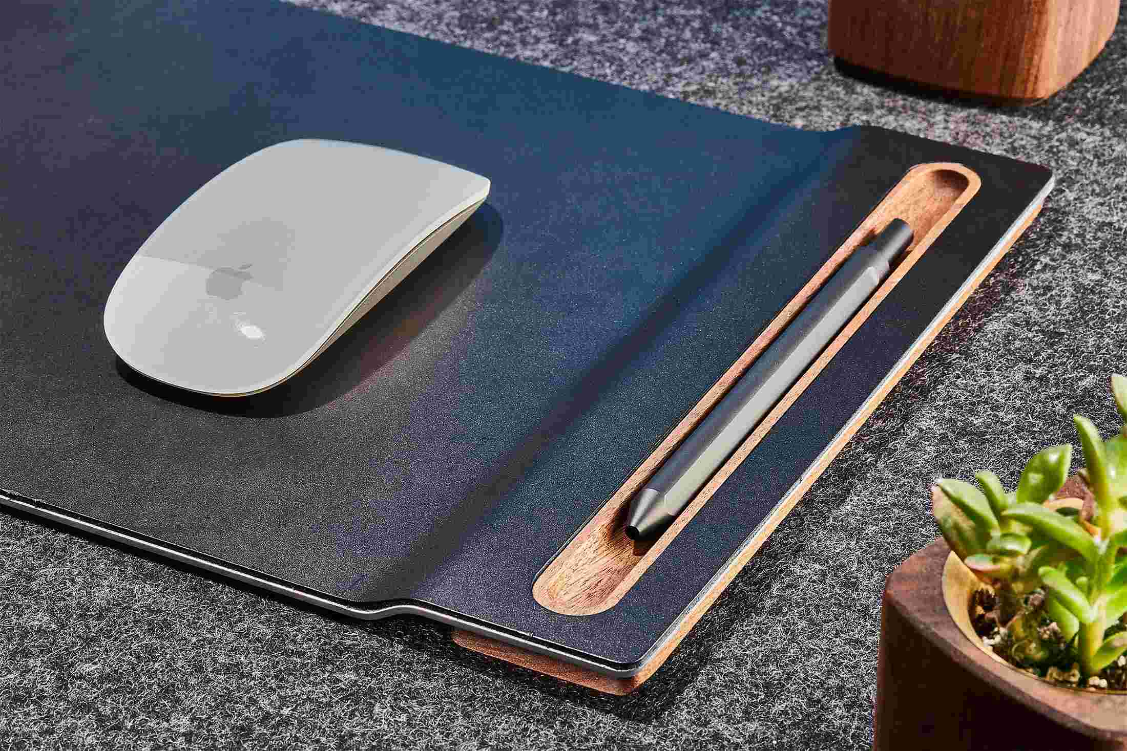 Detail of the walnut wood pen tray integrated into the Grovemade leather mouse pad