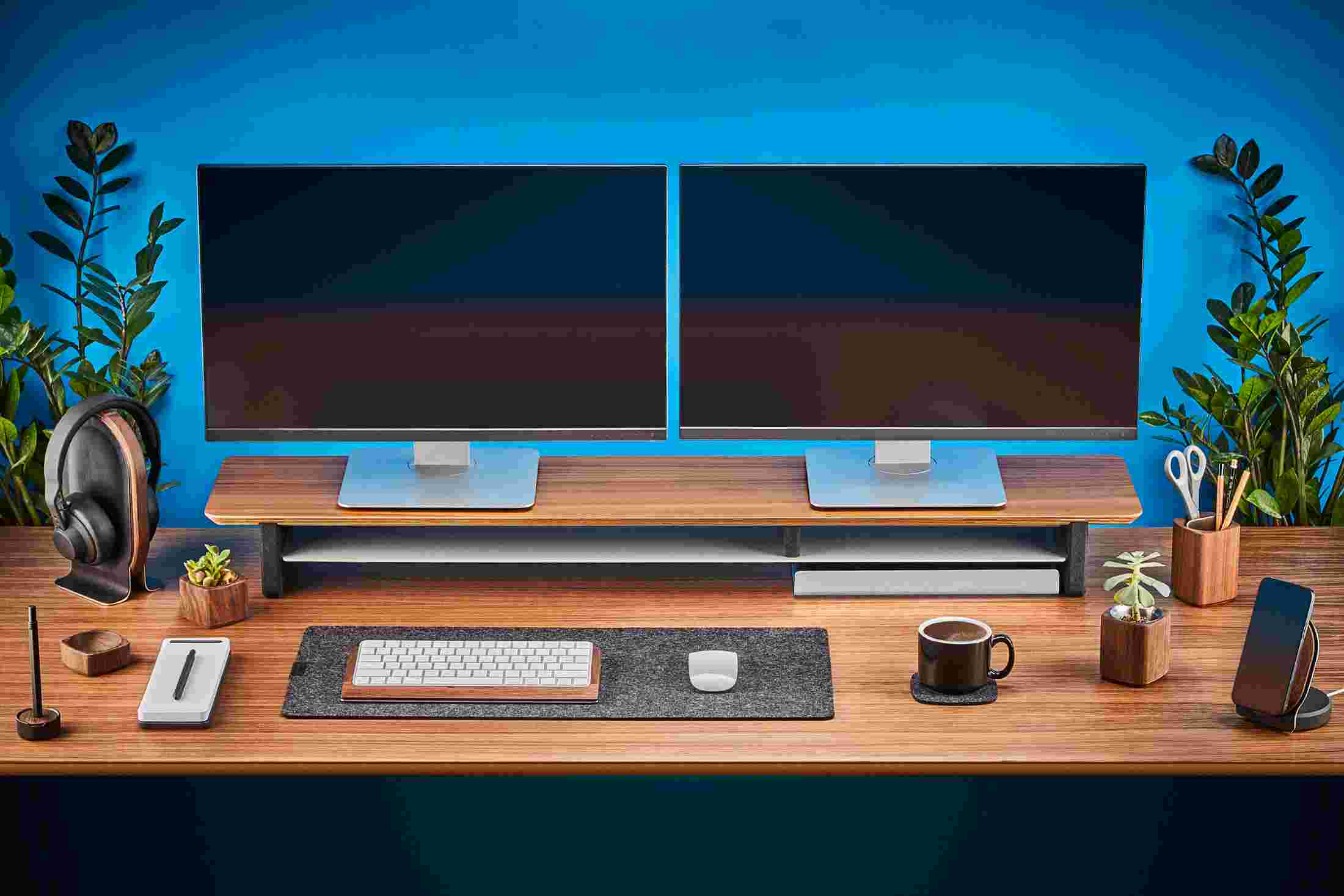 The small dark wool felt desk pad slides easily under the desk shelf.