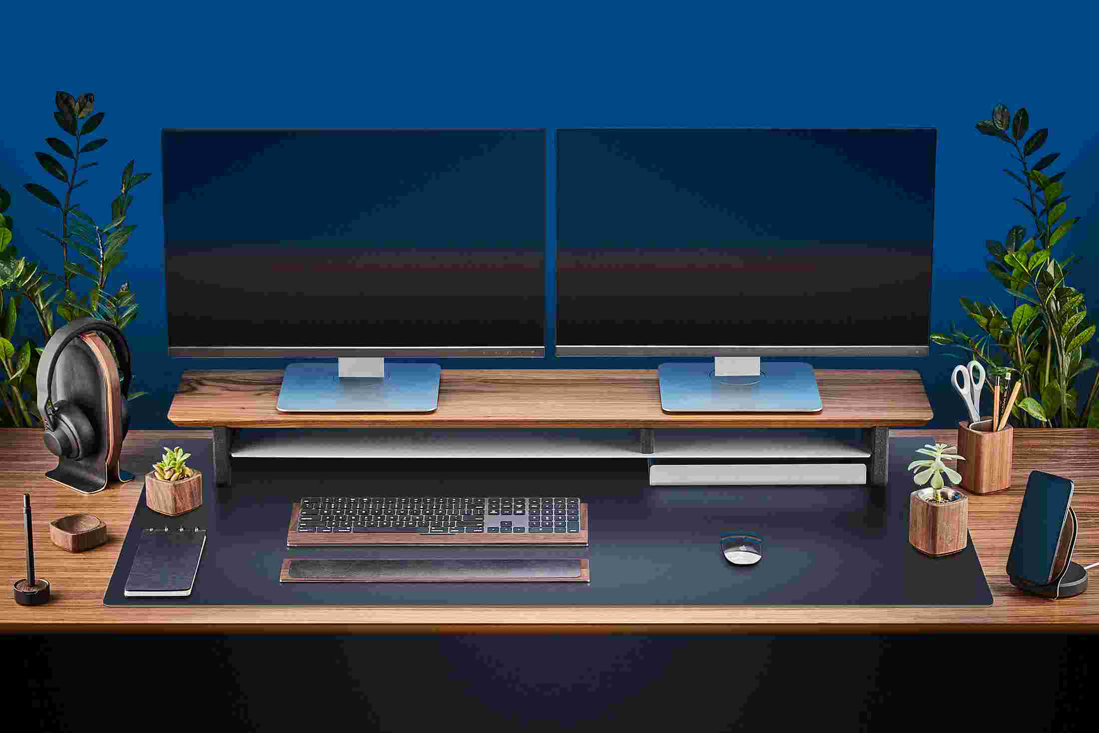 The Extra Large Matte Black Desk Pad supporting the entire Walnut Desk Shelf System.