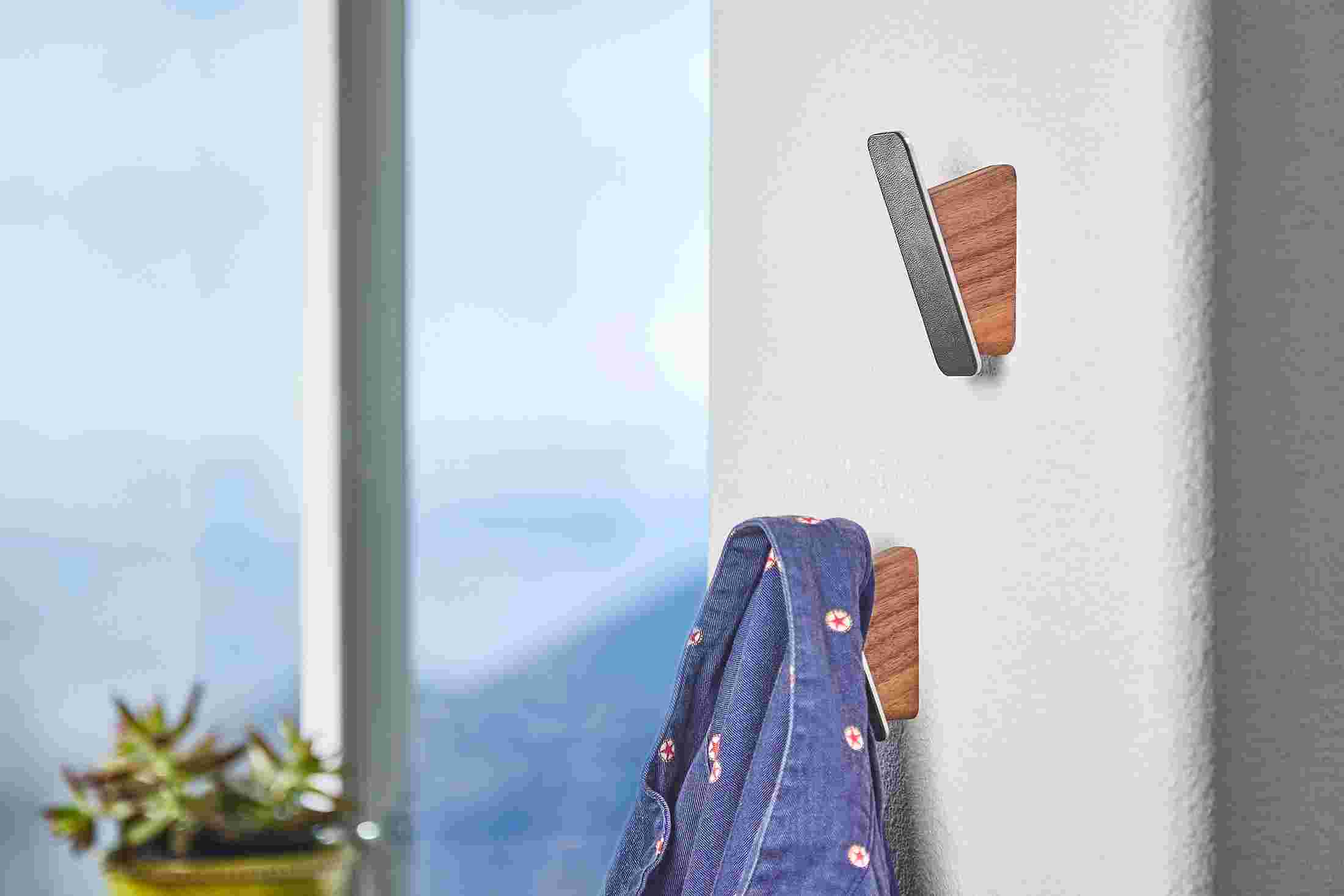 Two Walnut Wall Hooks with coat hanging.