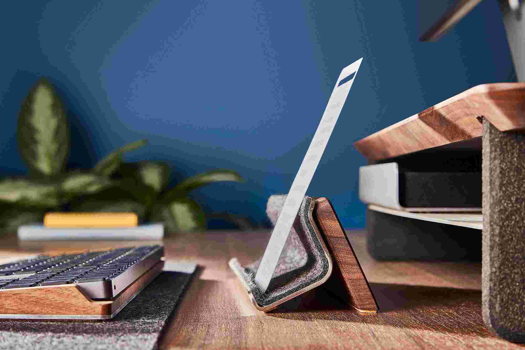 Profile view of the Walnut Display Rail with custom note card.