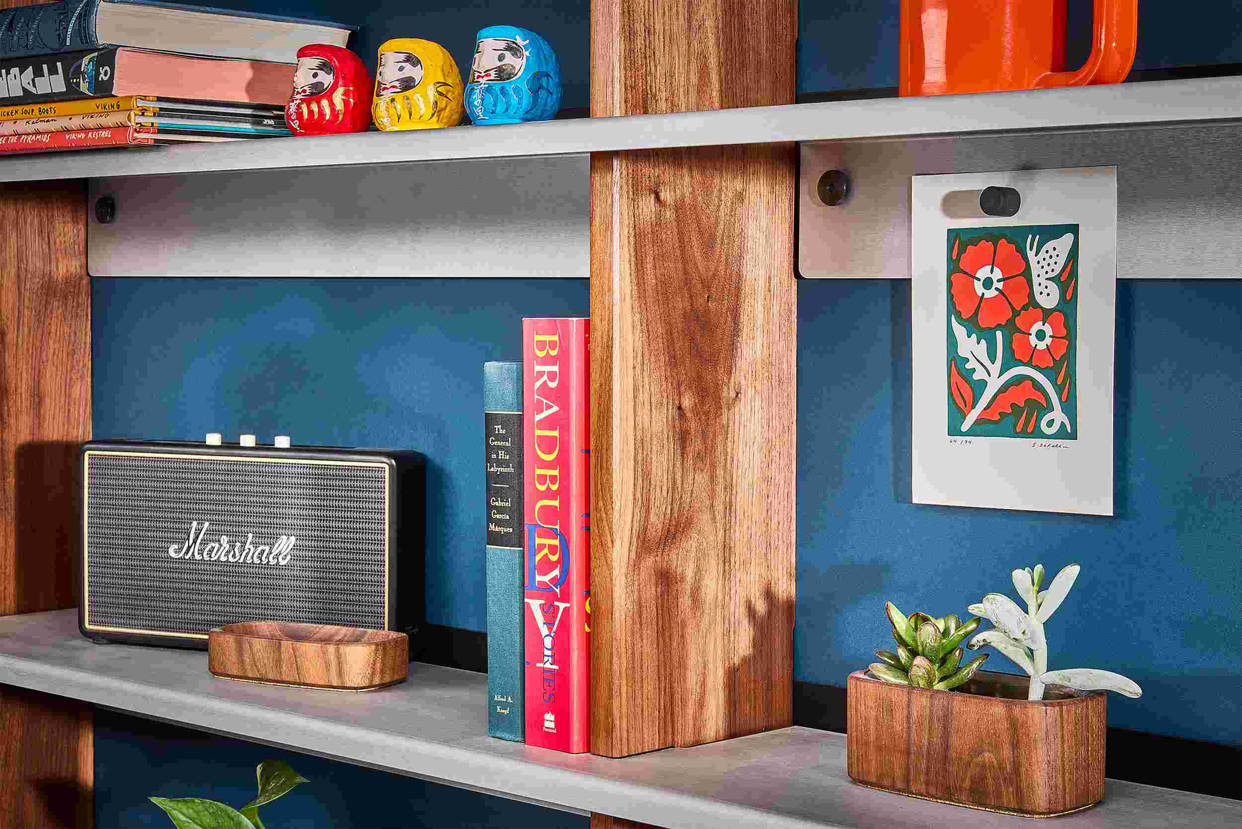 Detail of the wood and metal textures of the Grovemade walnut wall shelf.