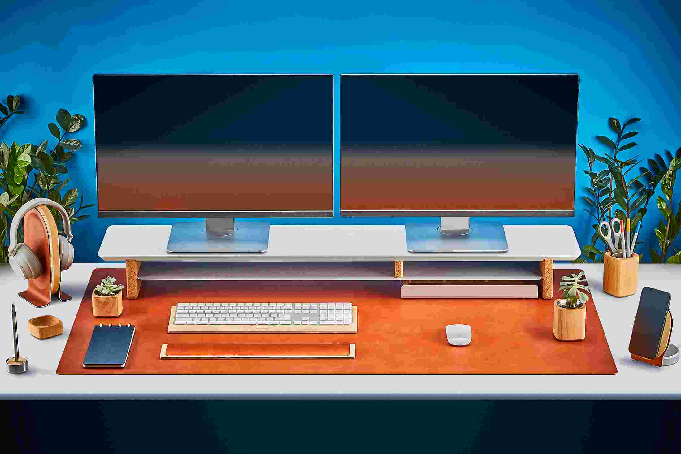 The Extra Large Felt Desk Pad supporting the entire Matte White Desk Shelf System featuring premium tan leather desk pad and keyboard tray.