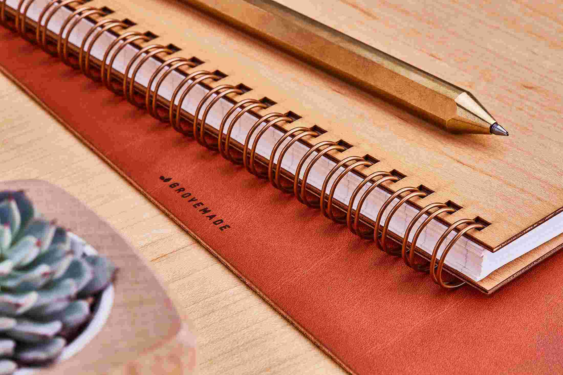 Detail of the brass spiral binding of the Grovemade Maple Notebook.