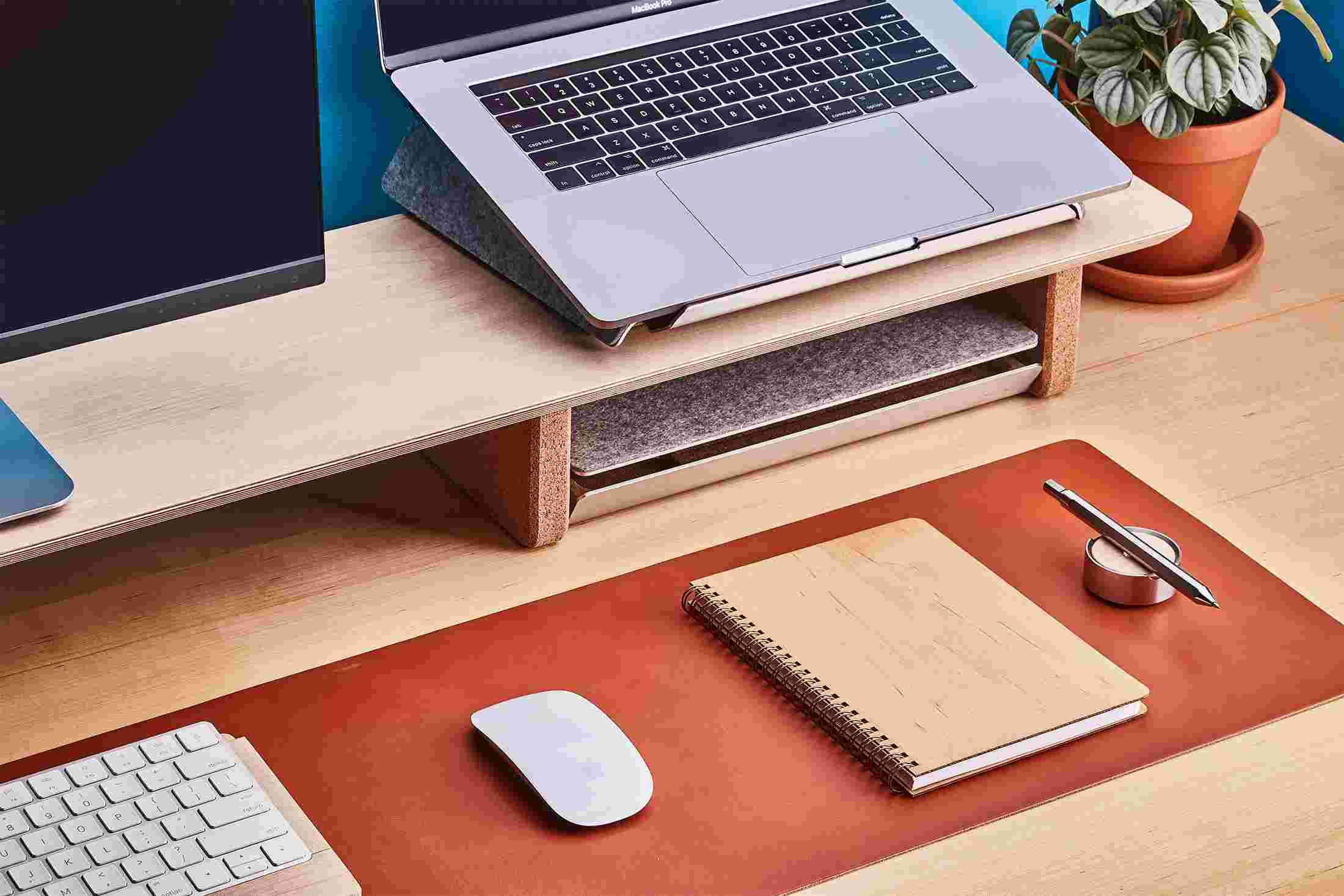 Wood notebook on maple desktop.