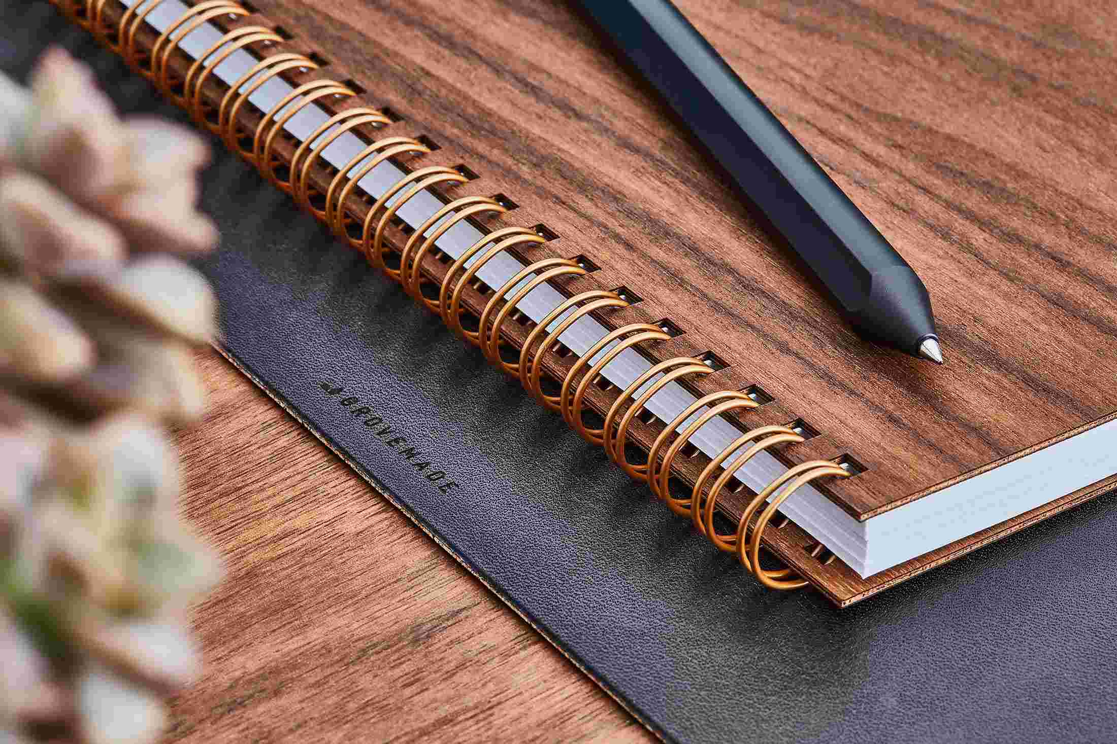 Detail of the brass spiral binding of the Grovemade Walnut Notebook.