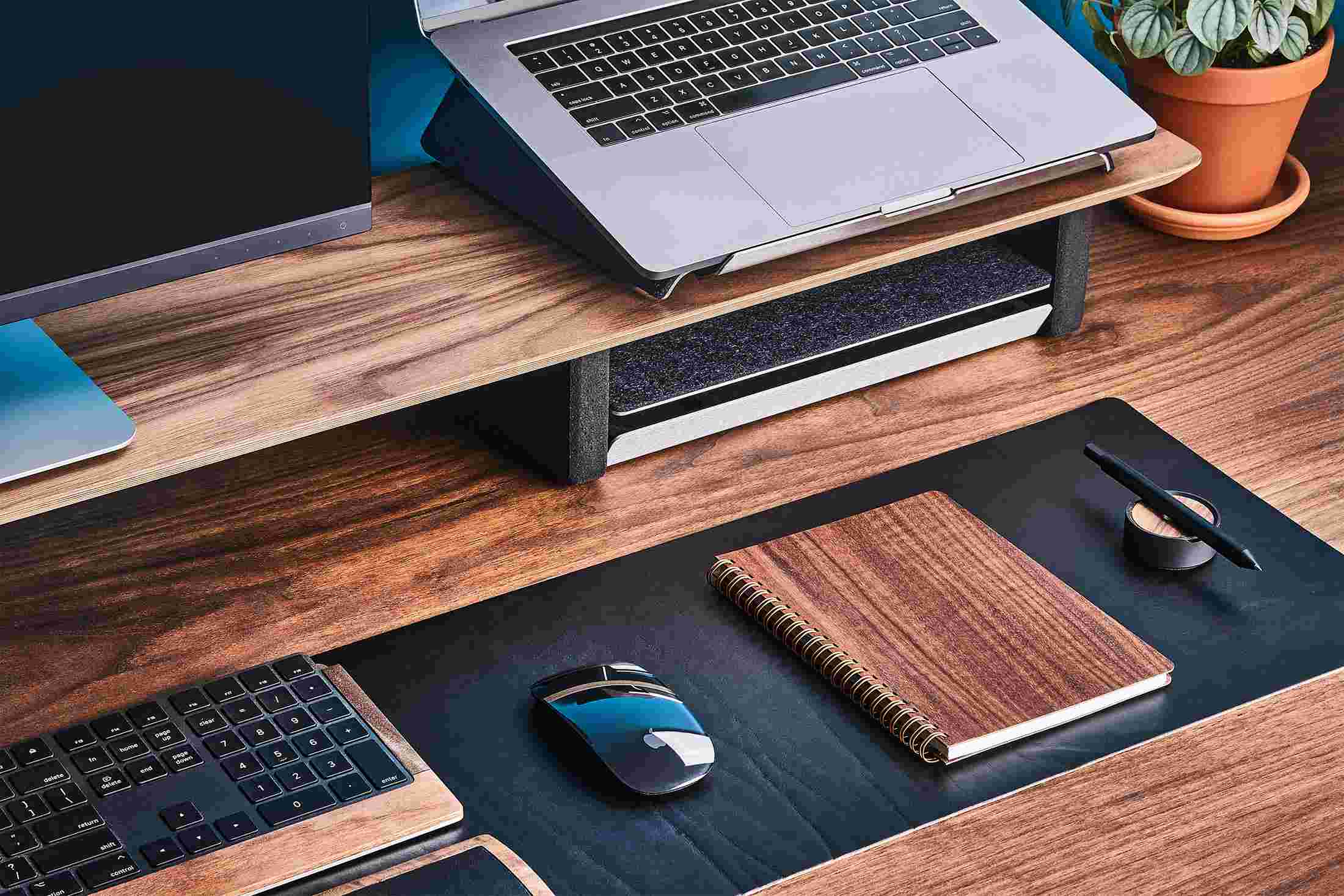 Wood notebook on walnut desktop.