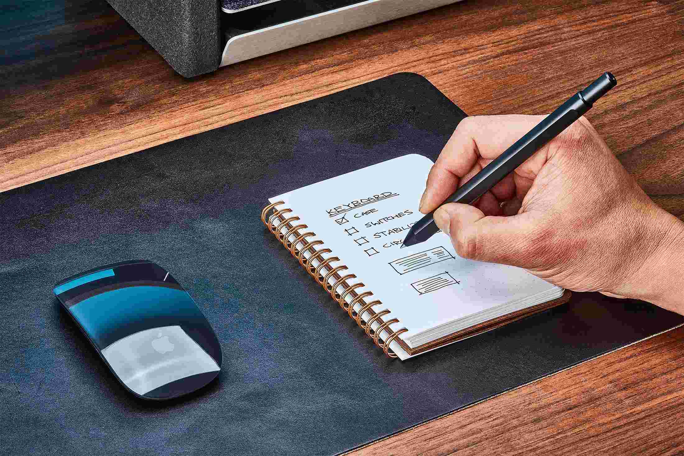 The walnut notebook with cover folded back flat for easy writing.