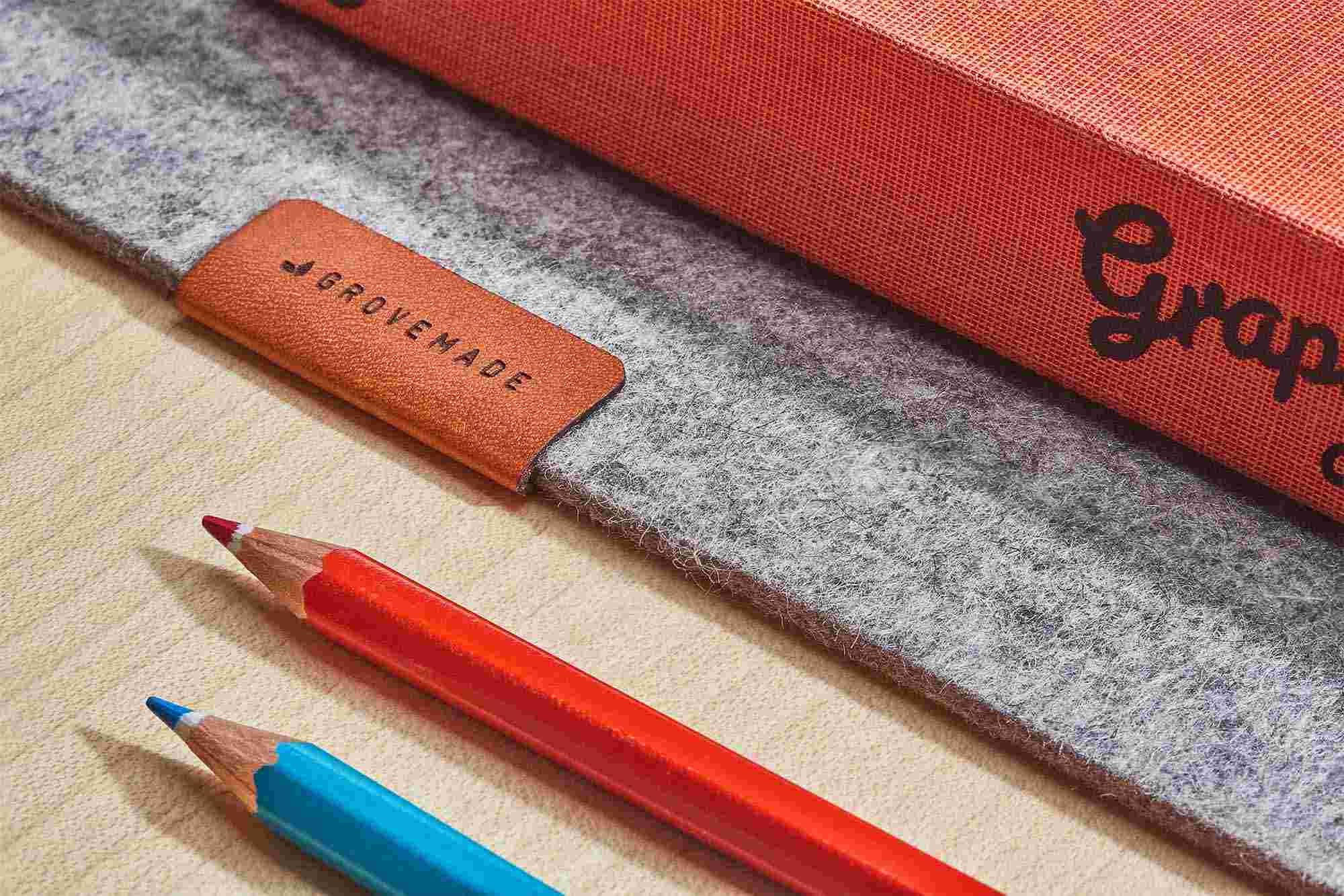 Detail of the premium wool felt texture and natural leather tag.