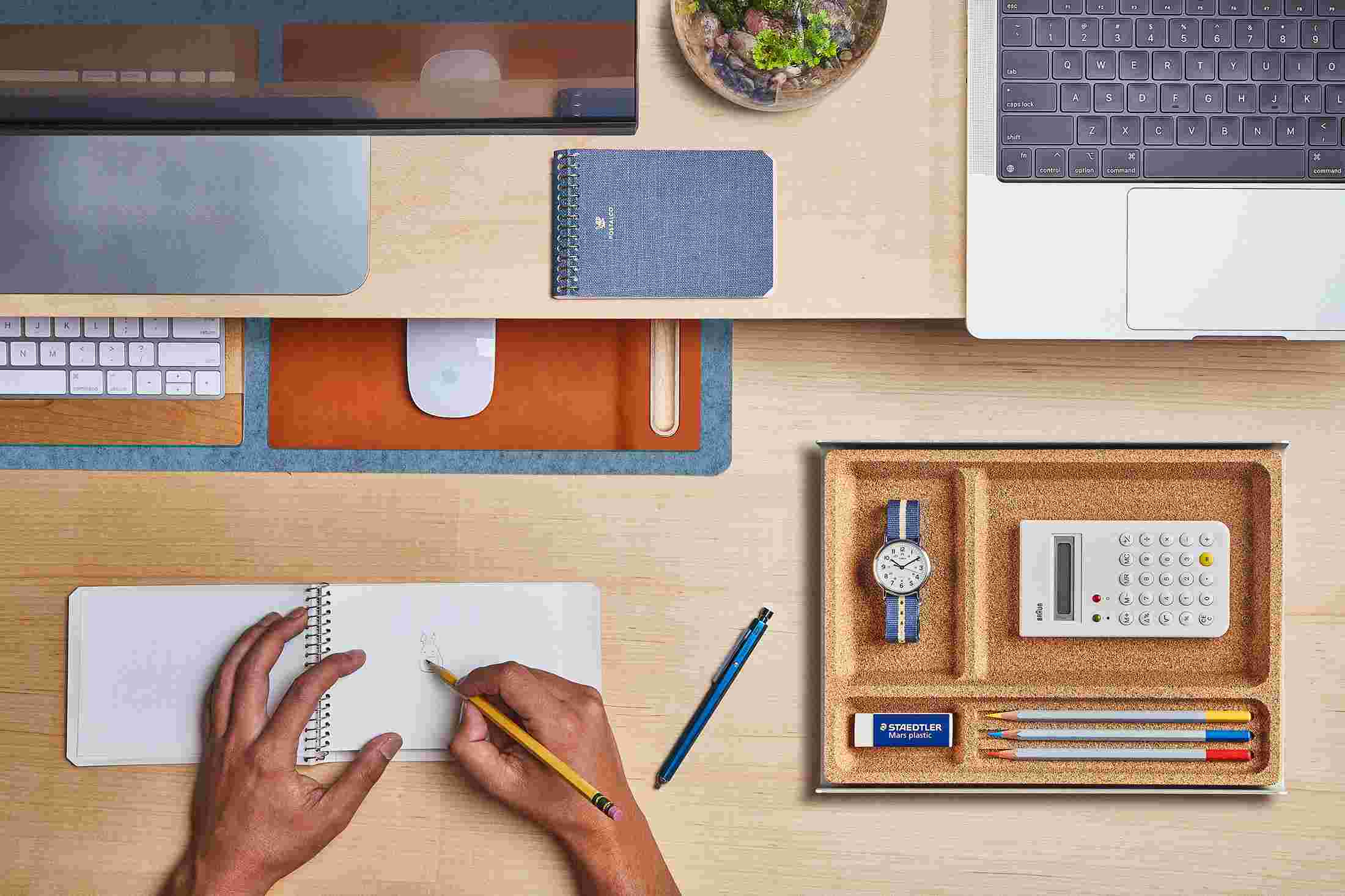 The Small Light Blue Wool Felt Desk Pad tucked under the Maple Desk Shelf, creating space to sketch and write.