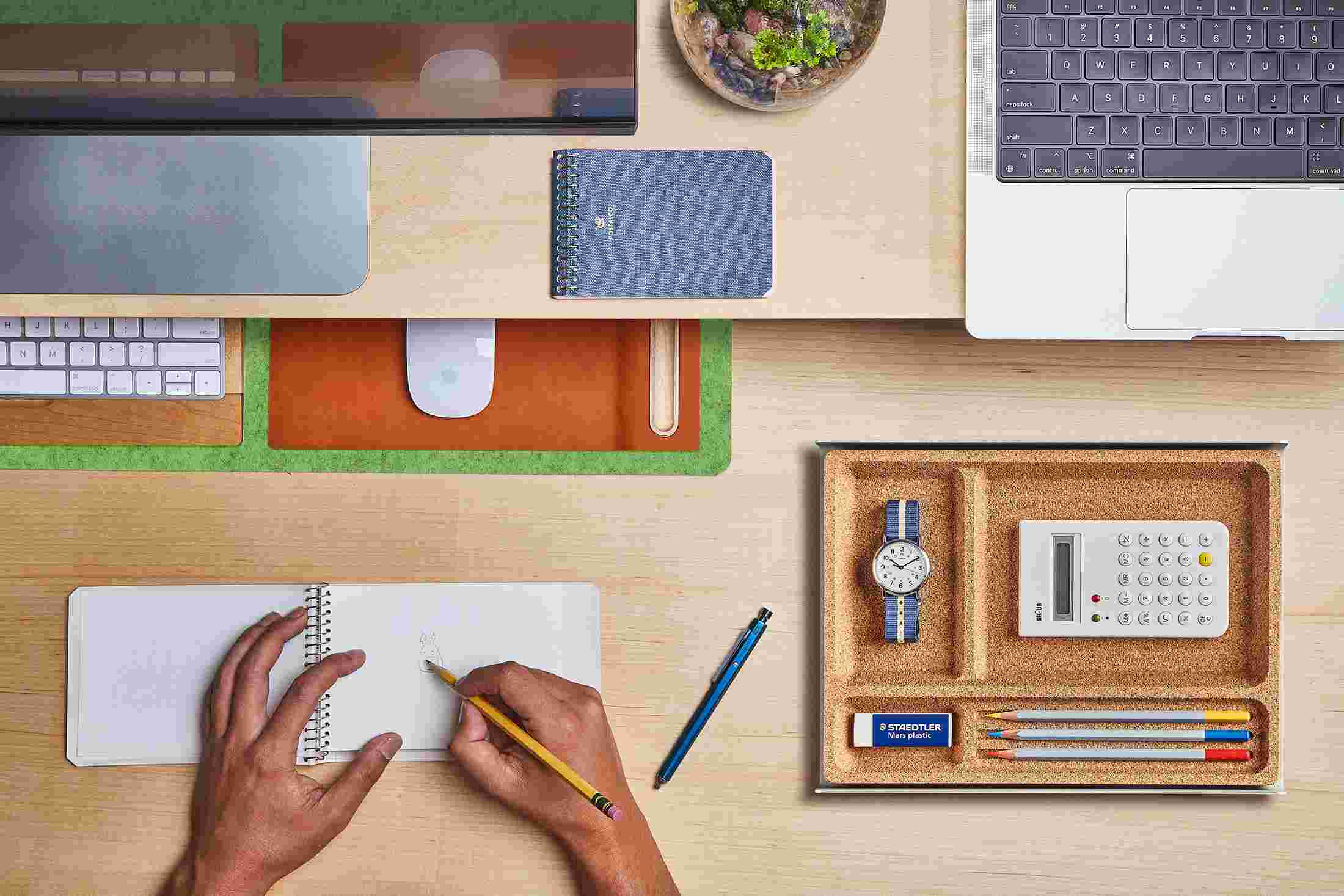 The Small Light Green Wool Felt Desk Pad tucked under the Maple Desk Shelf, creating space to sketch and write.