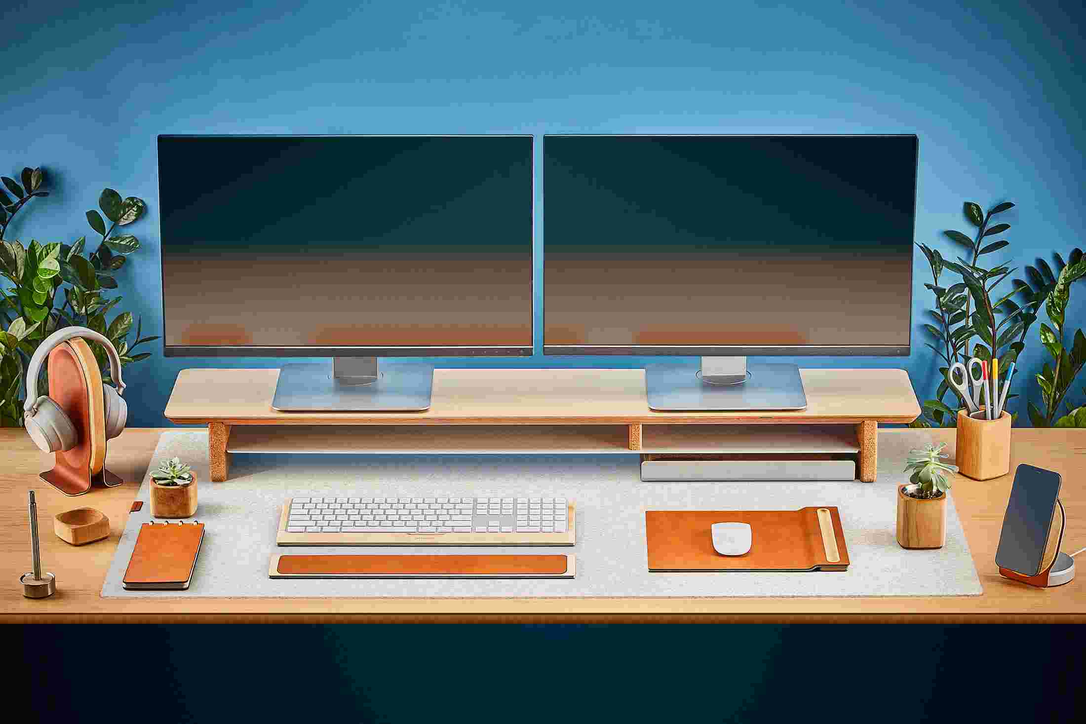The Extra Large Wool Felt Desk Pad in White covering almost an entire desktop, in use with the Maple Desk Shelf System.