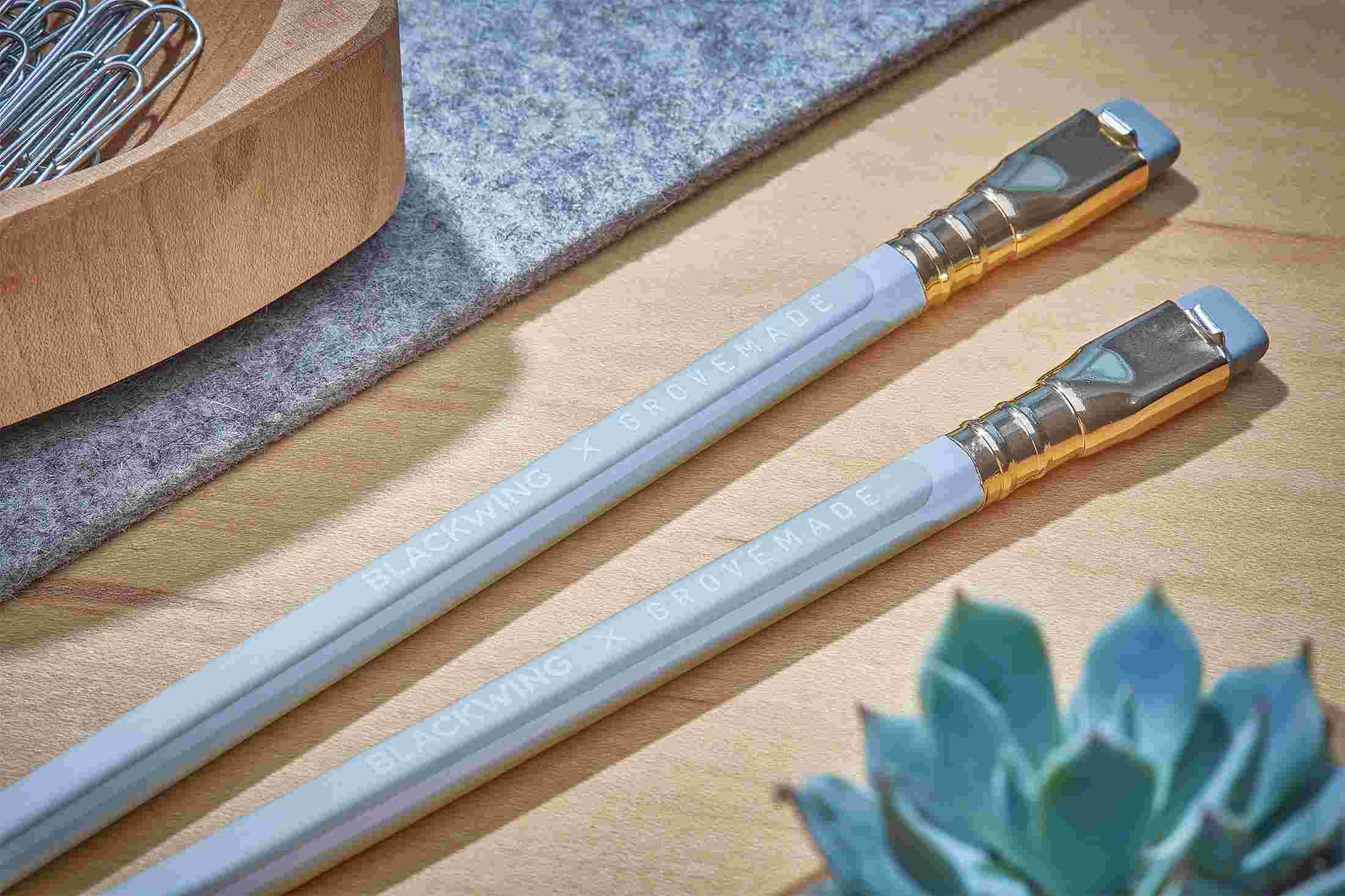 Closeup detail of embossed logo on white pencil.