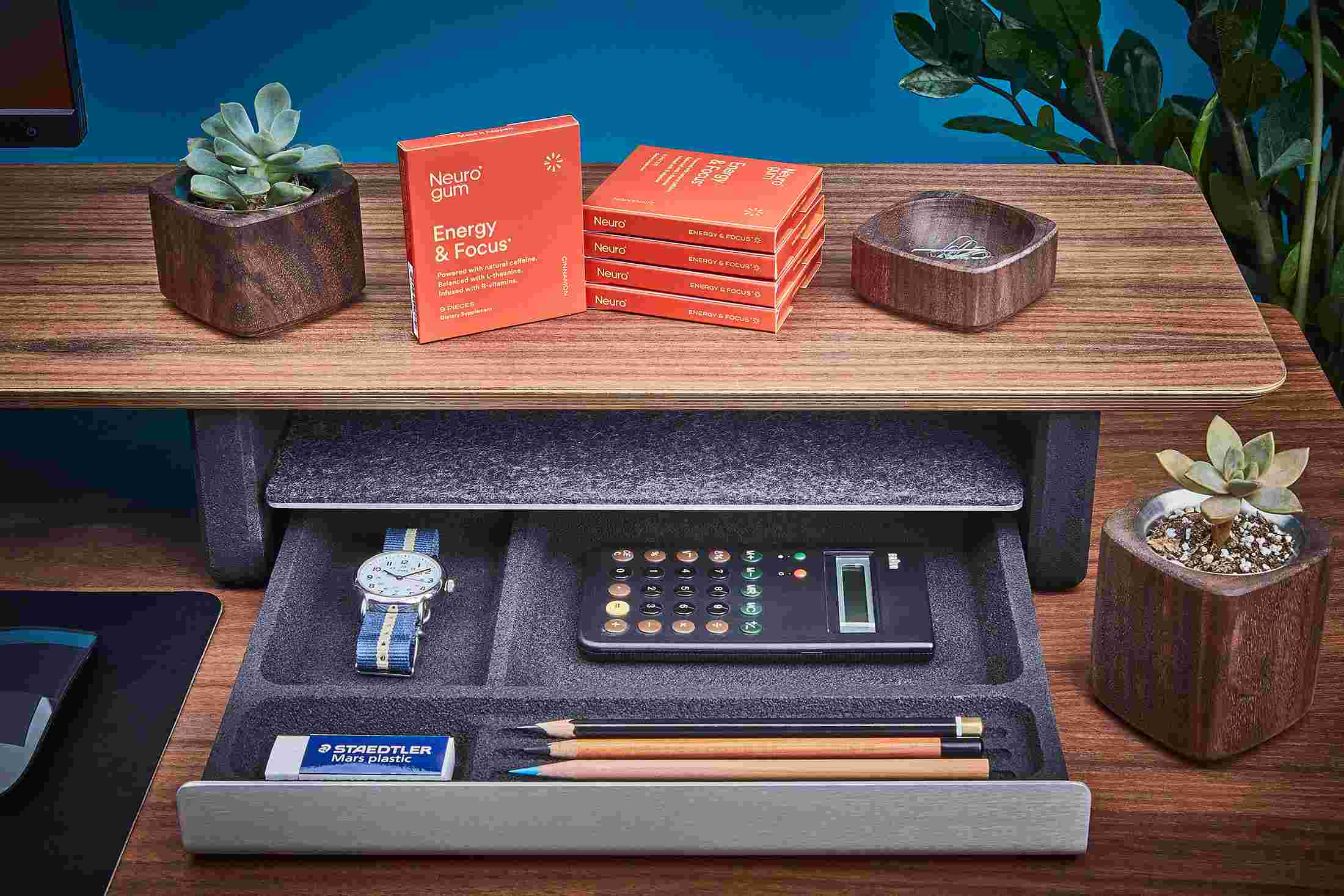 Stack of Neuro Gum on the Grovemade Walnut Desk Shelf.